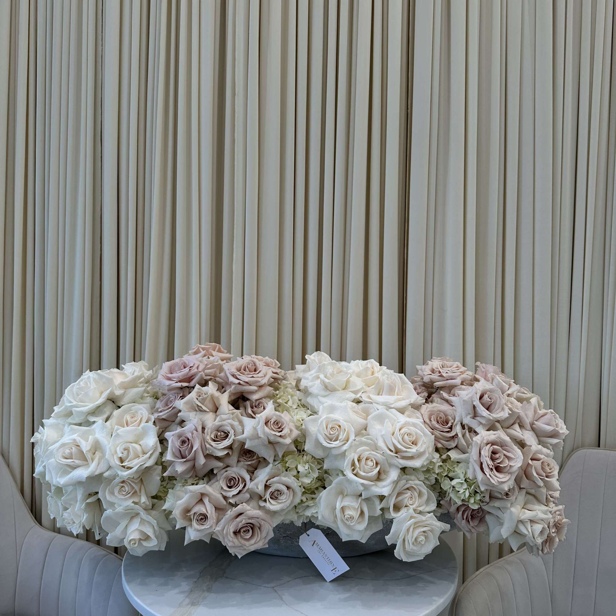 Symbolize purity and love with this classic bouquet of white and blush