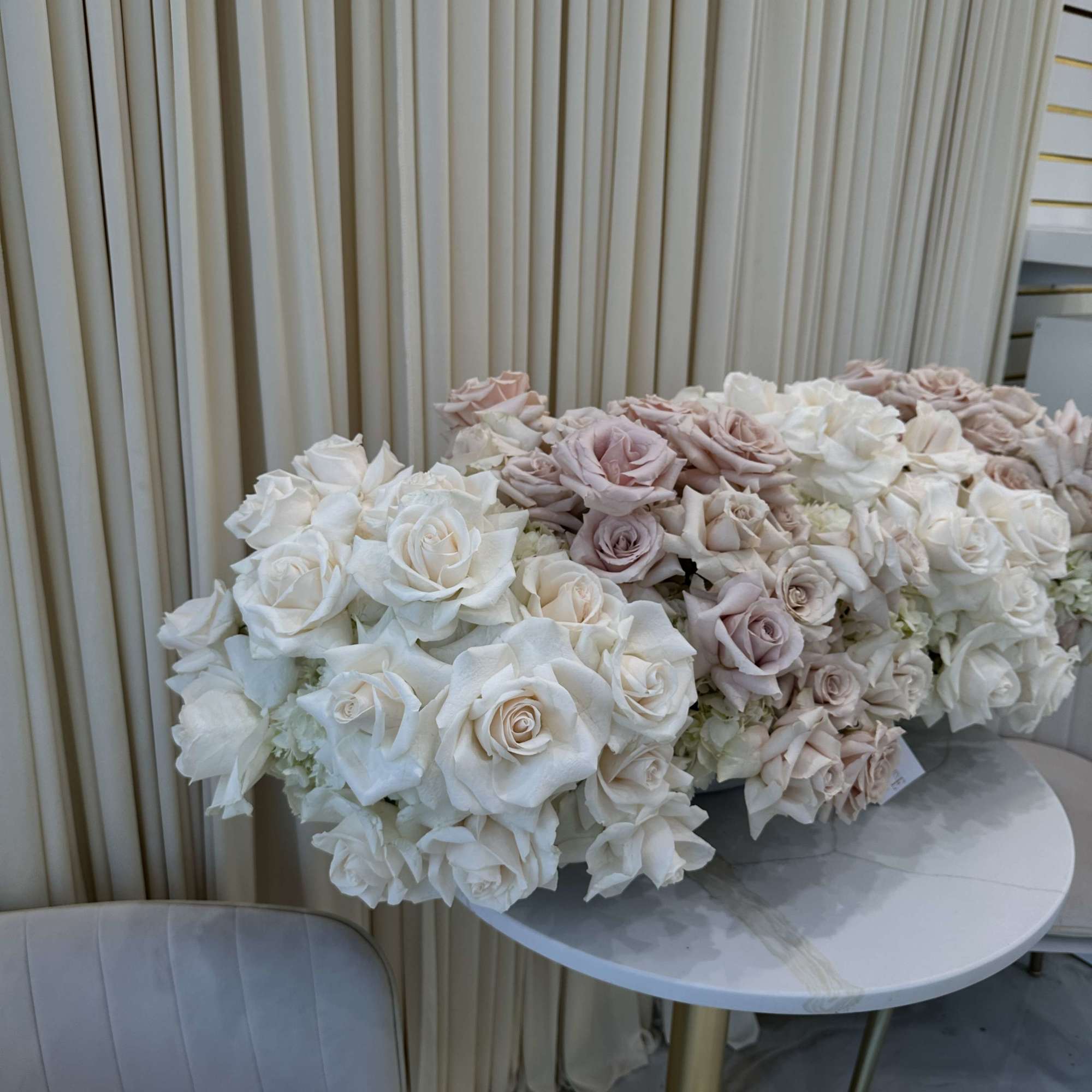 Symbolize purity and love with this classic bouquet of white and blush