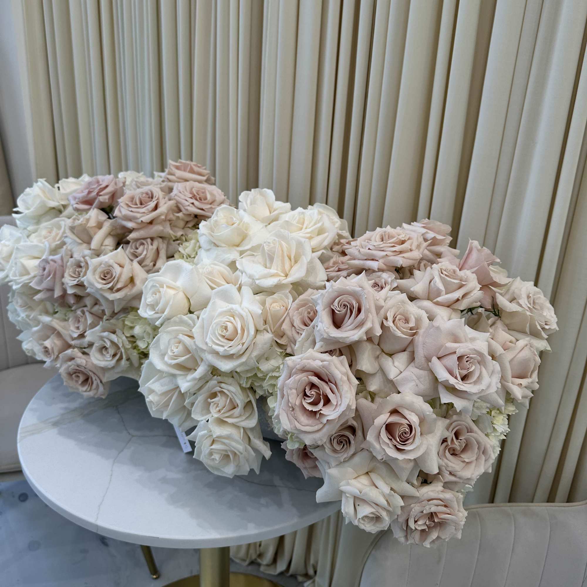 Symbolize purity and love with this classic bouquet of white and blush