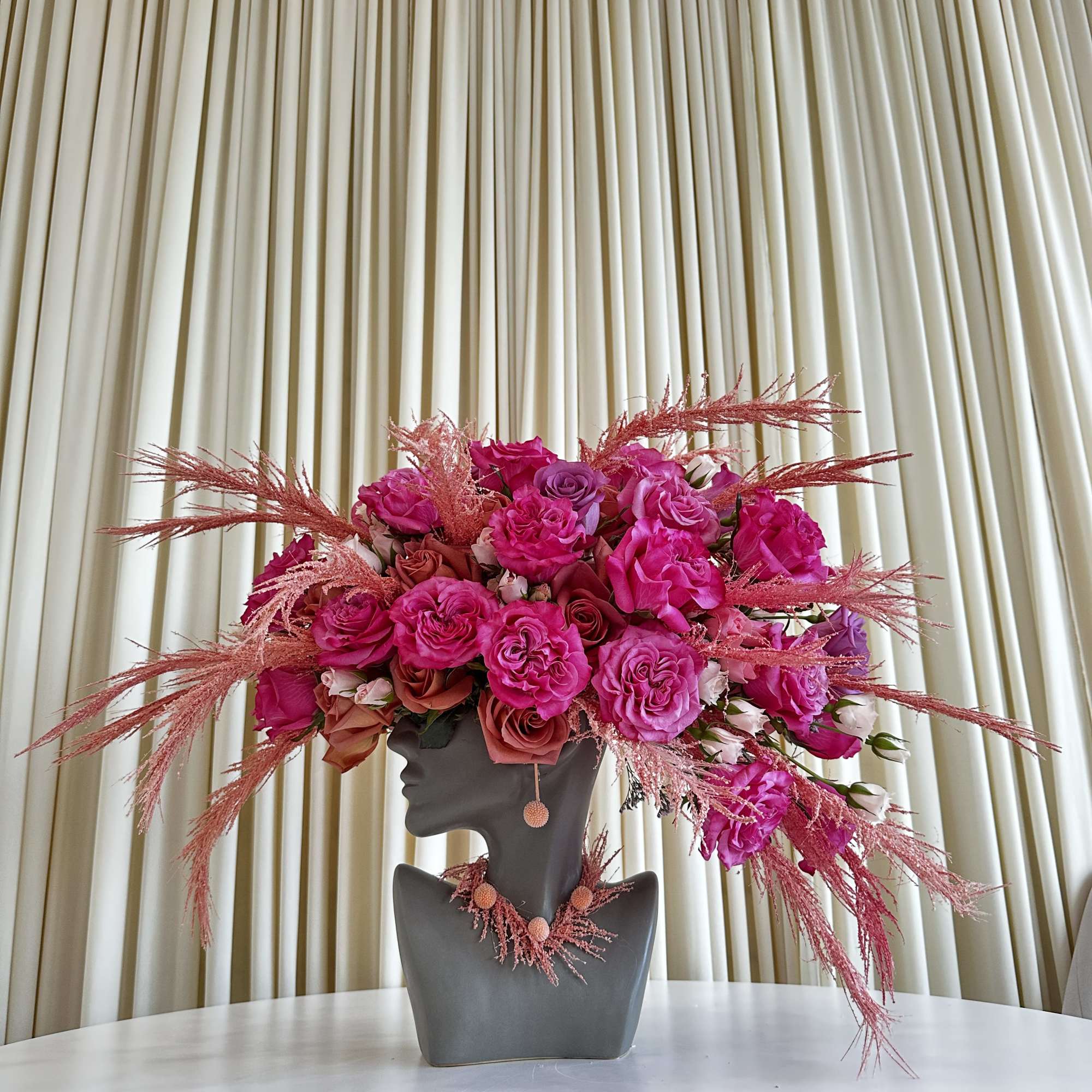Experience the allure of &quot;Vibrant Splendor,&quot; a head-shaped flower arrangement that embraces