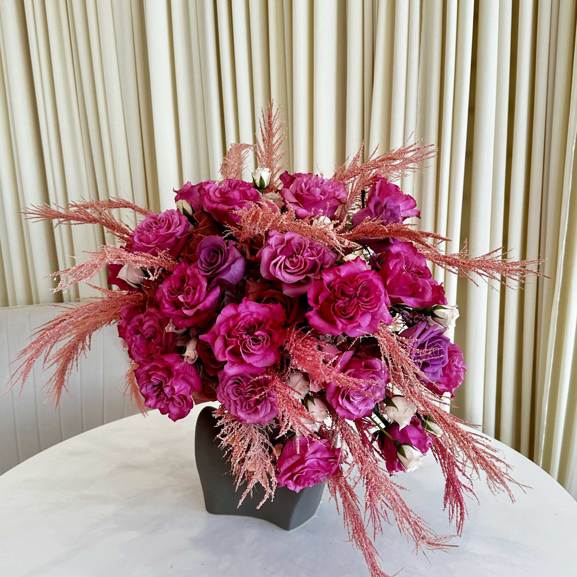 Experience the allure of &quot;Vibrant Splendor,&quot; a head-shaped flower arrangement that embraces