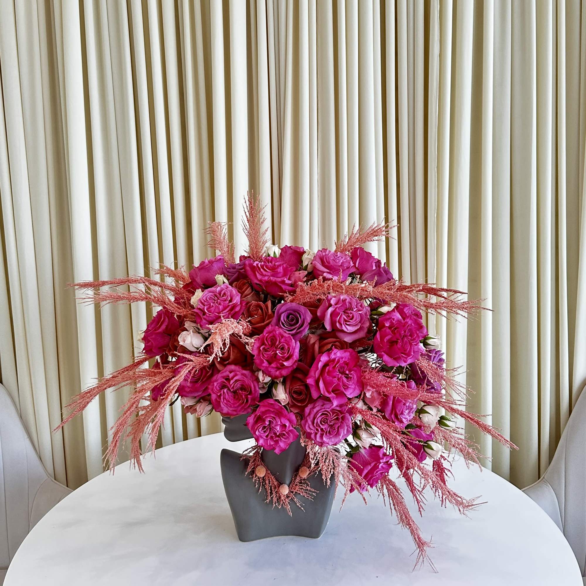 Experience the allure of &quot;Vibrant Splendor,&quot; a head-shaped flower arrangement that embraces