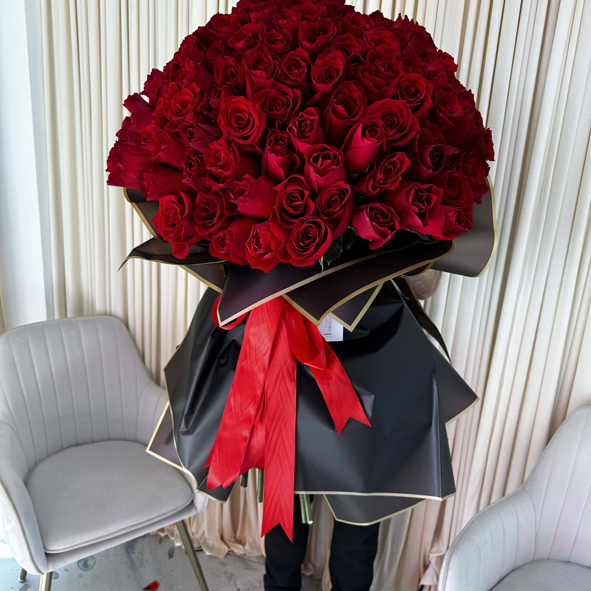This decadent bouquet of 150 red roses is a powerful symbol of