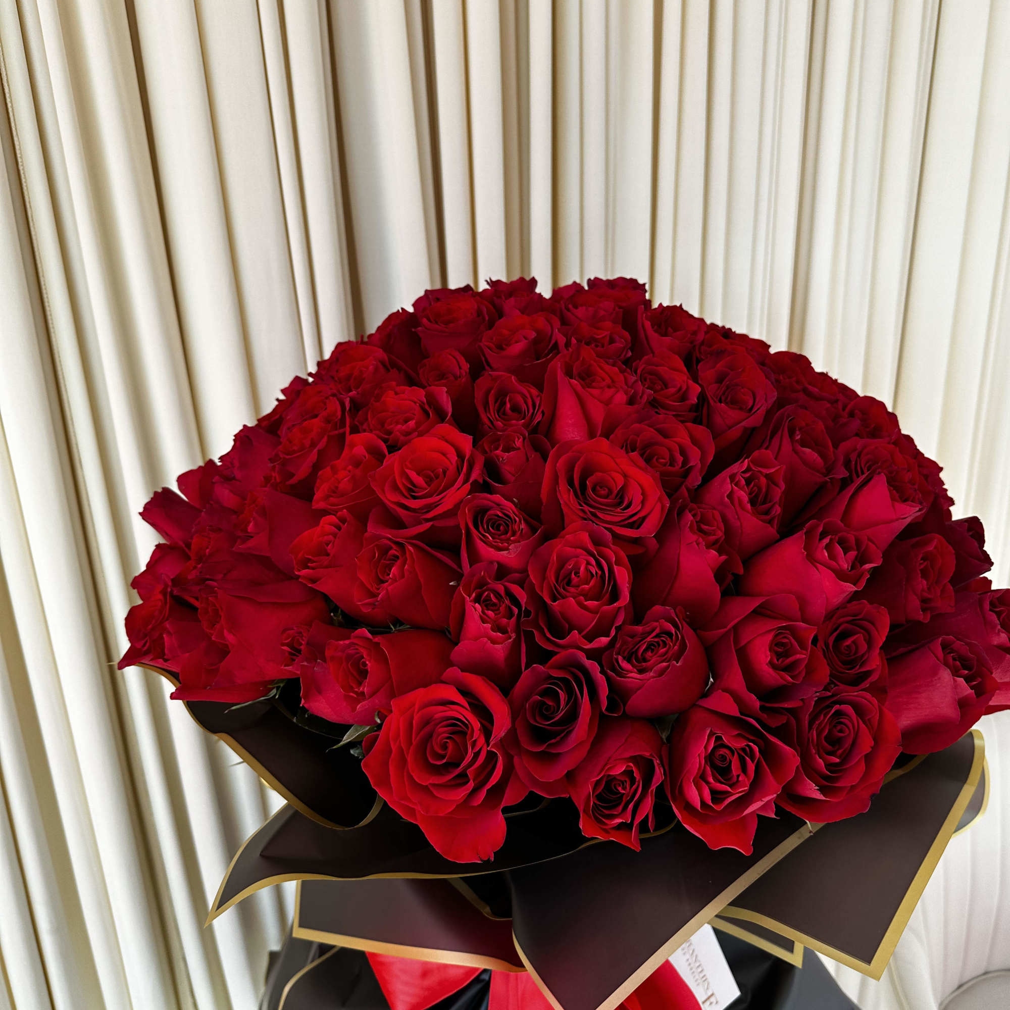 This decadent bouquet of 150 red roses is a powerful symbol of