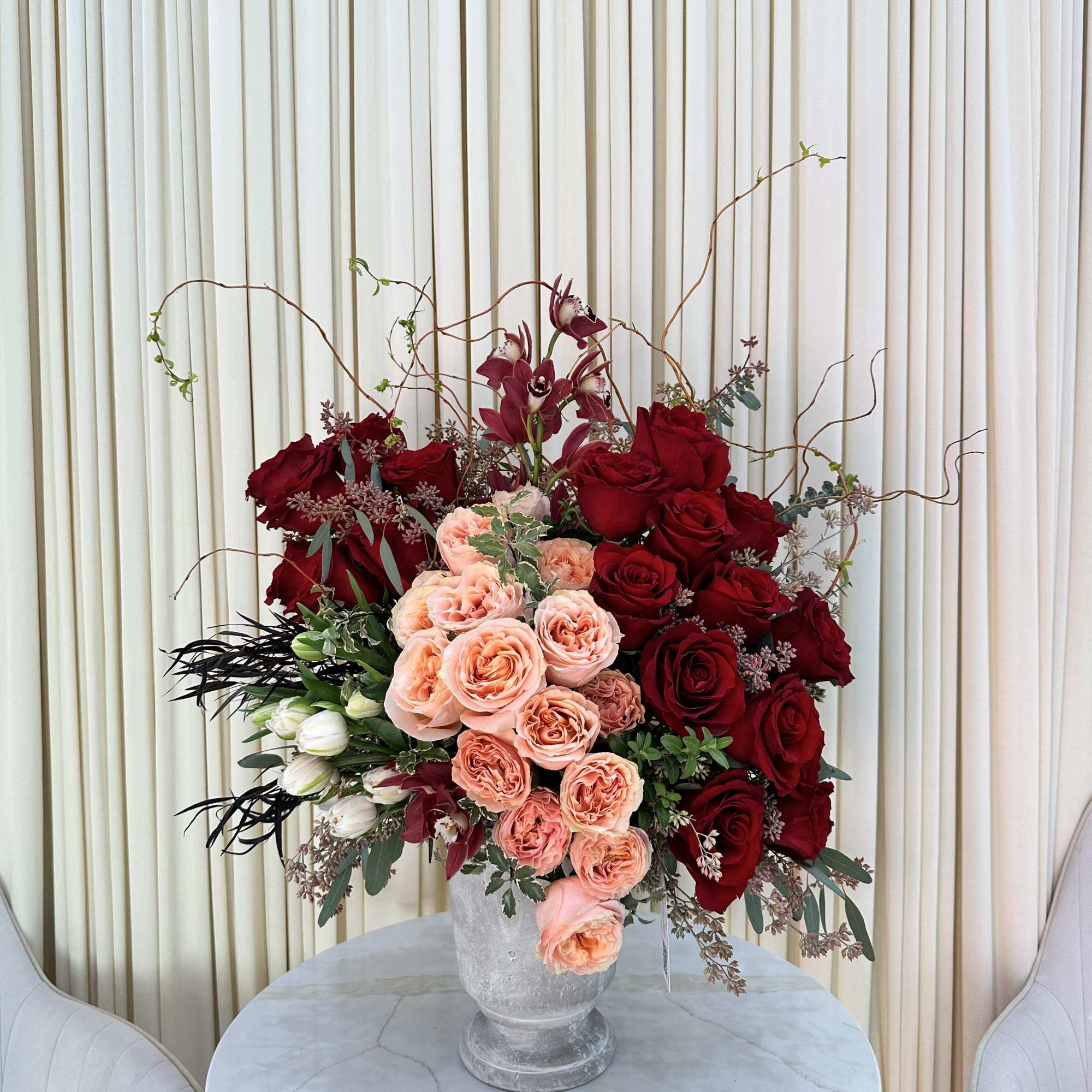 This captivating arrangement showcases a stunning harmony of color and texture. Rich