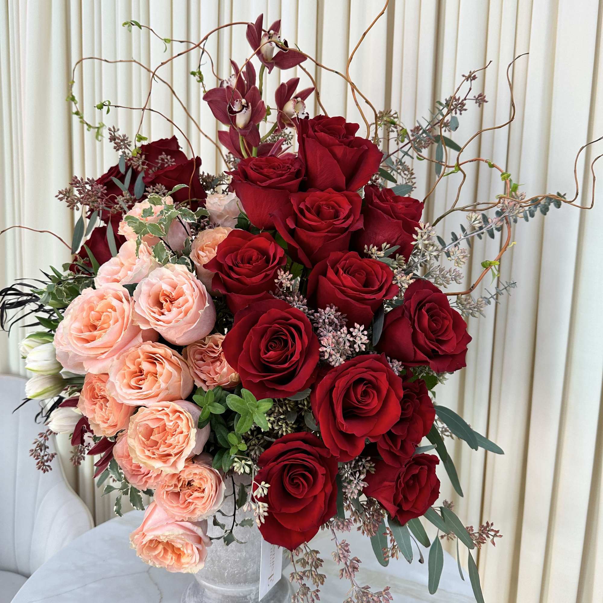 This captivating arrangement showcases a stunning harmony of color and texture. Rich
