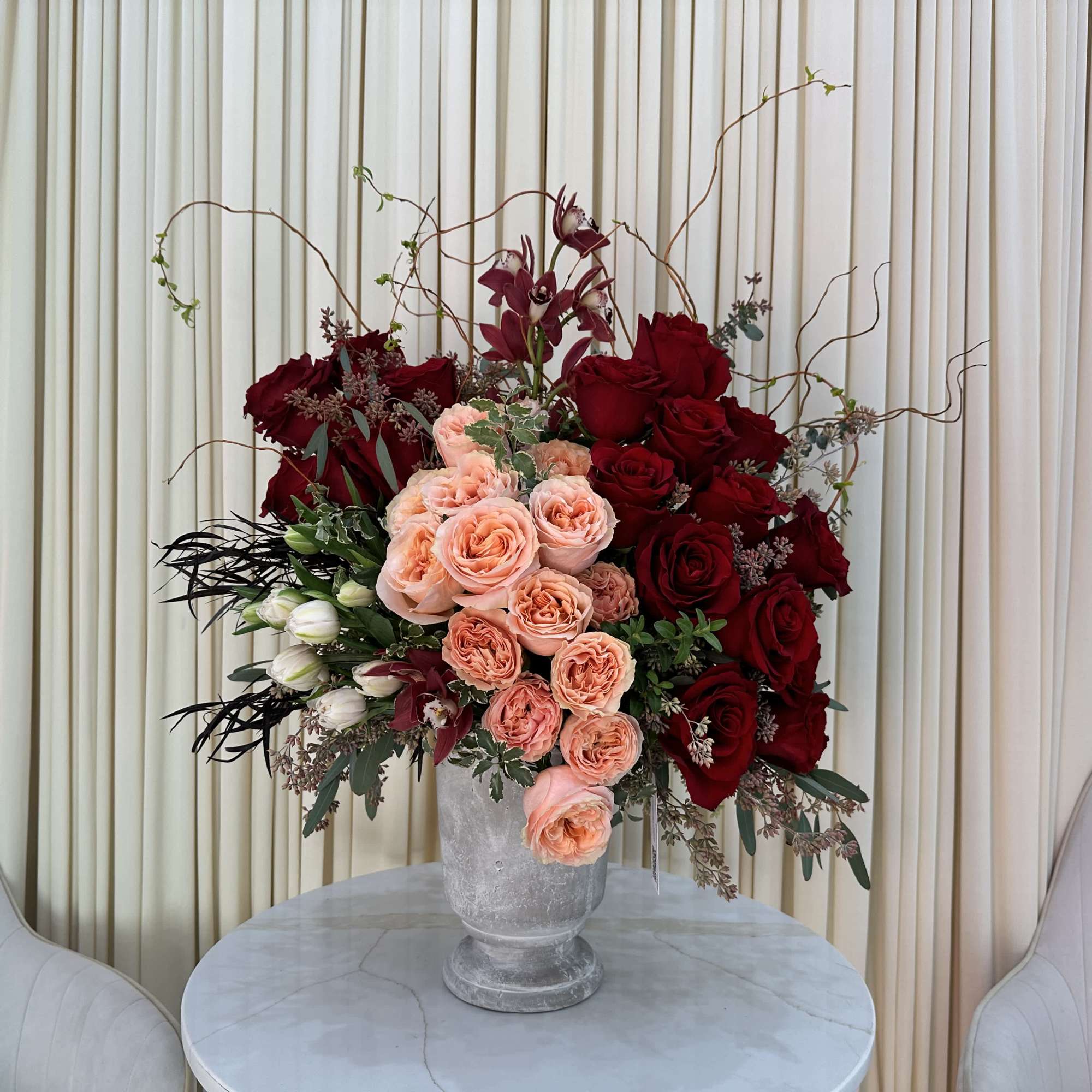 This captivating arrangement showcases a stunning harmony of color and texture. Rich