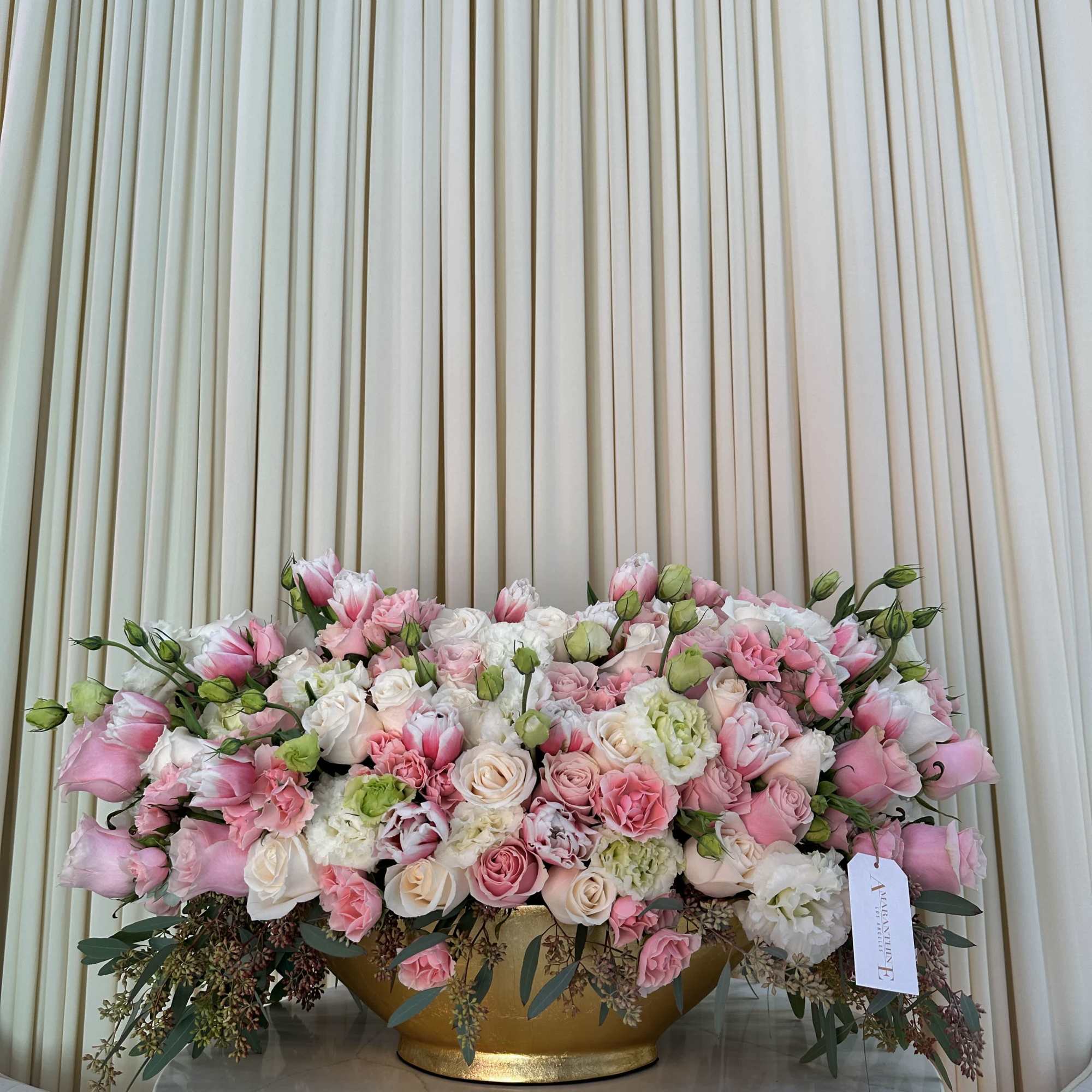 This stunning bouquet features a vibrant mix of pink and white roses