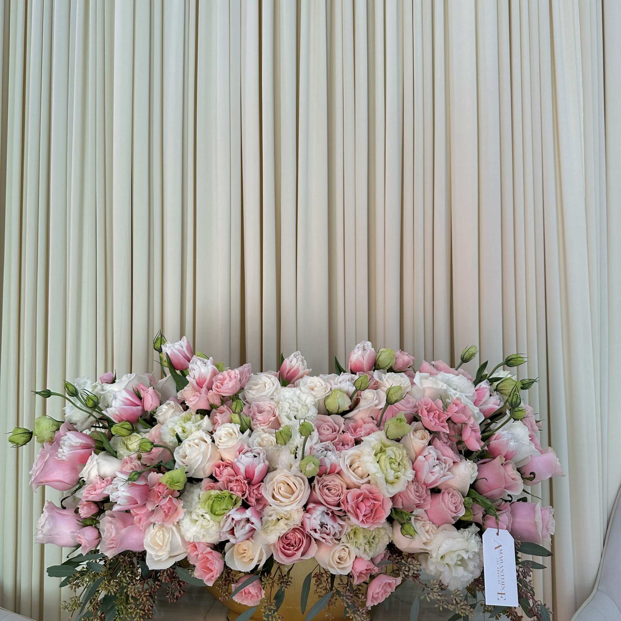 This stunning bouquet features a vibrant mix of pink and white roses