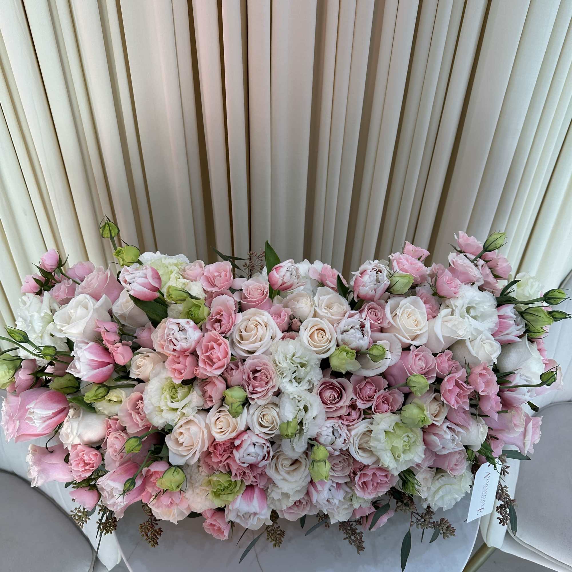 This stunning bouquet features a vibrant mix of pink and white roses