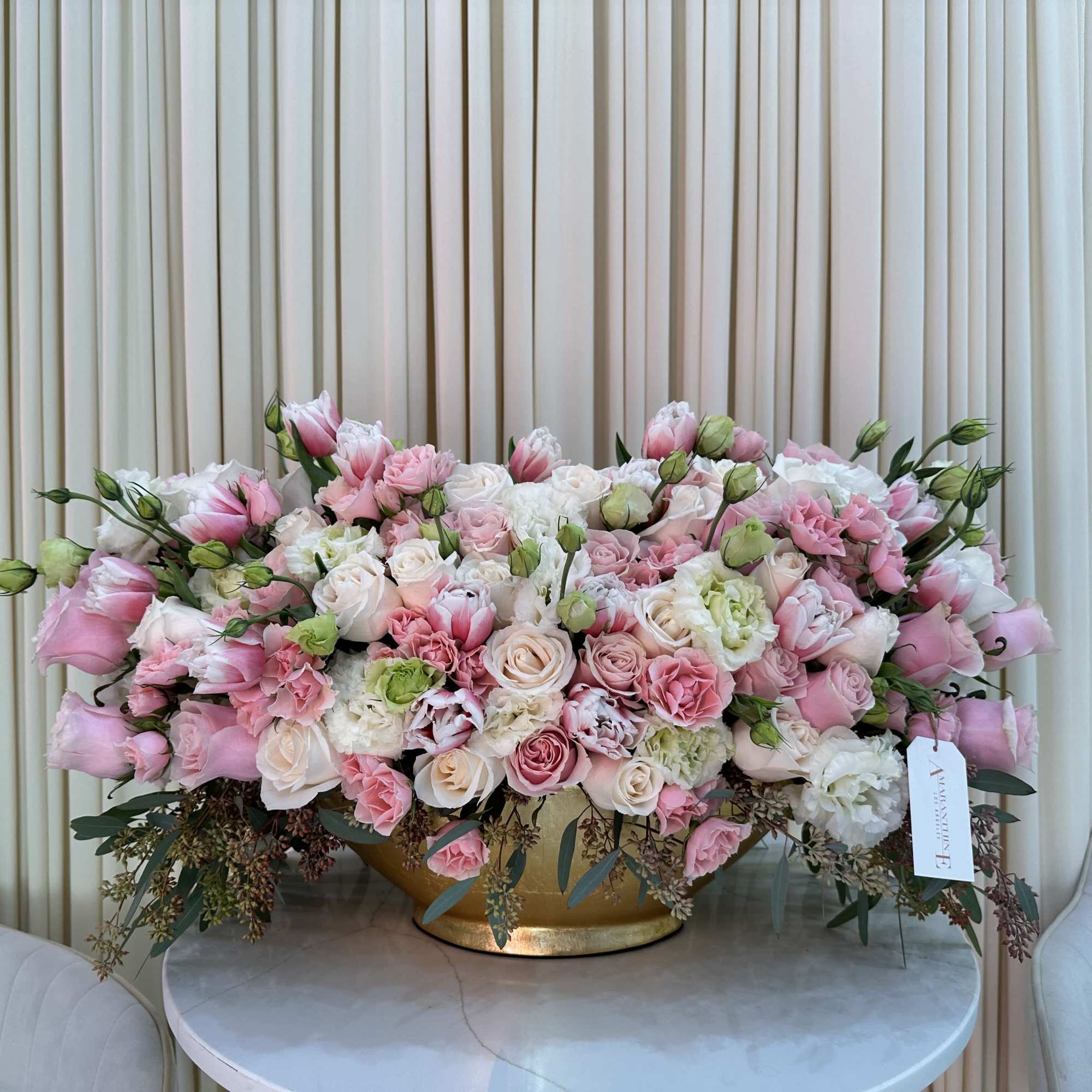 This stunning bouquet features a vibrant mix of pink and white roses