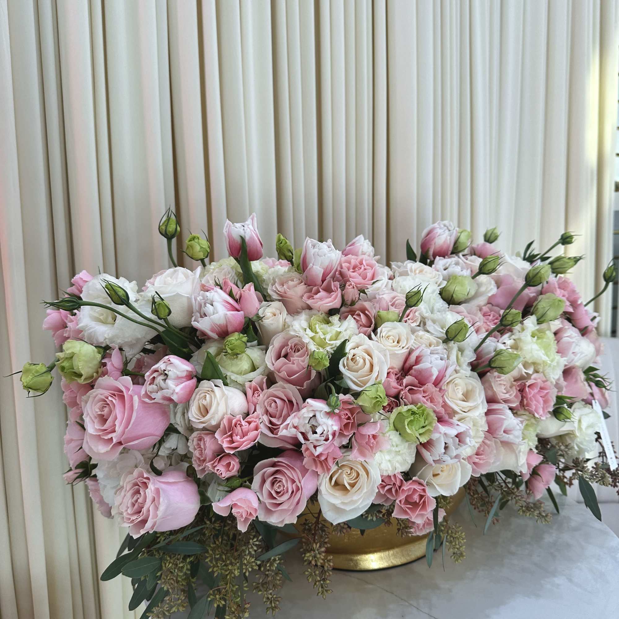 This stunning bouquet features a vibrant mix of pink and white roses