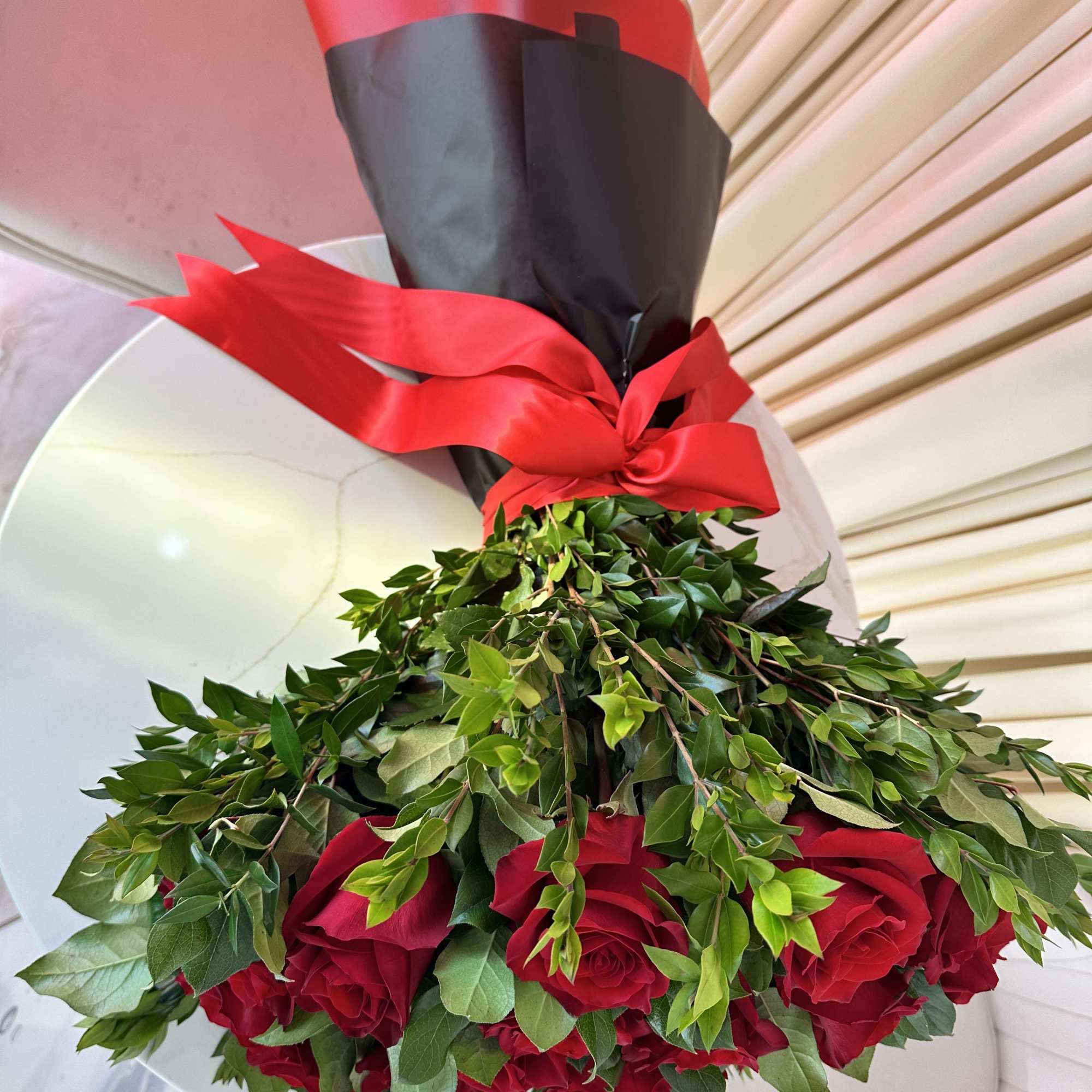 Celebrate a momentous occasion with this breathtaking bouquet of 25 fiery red