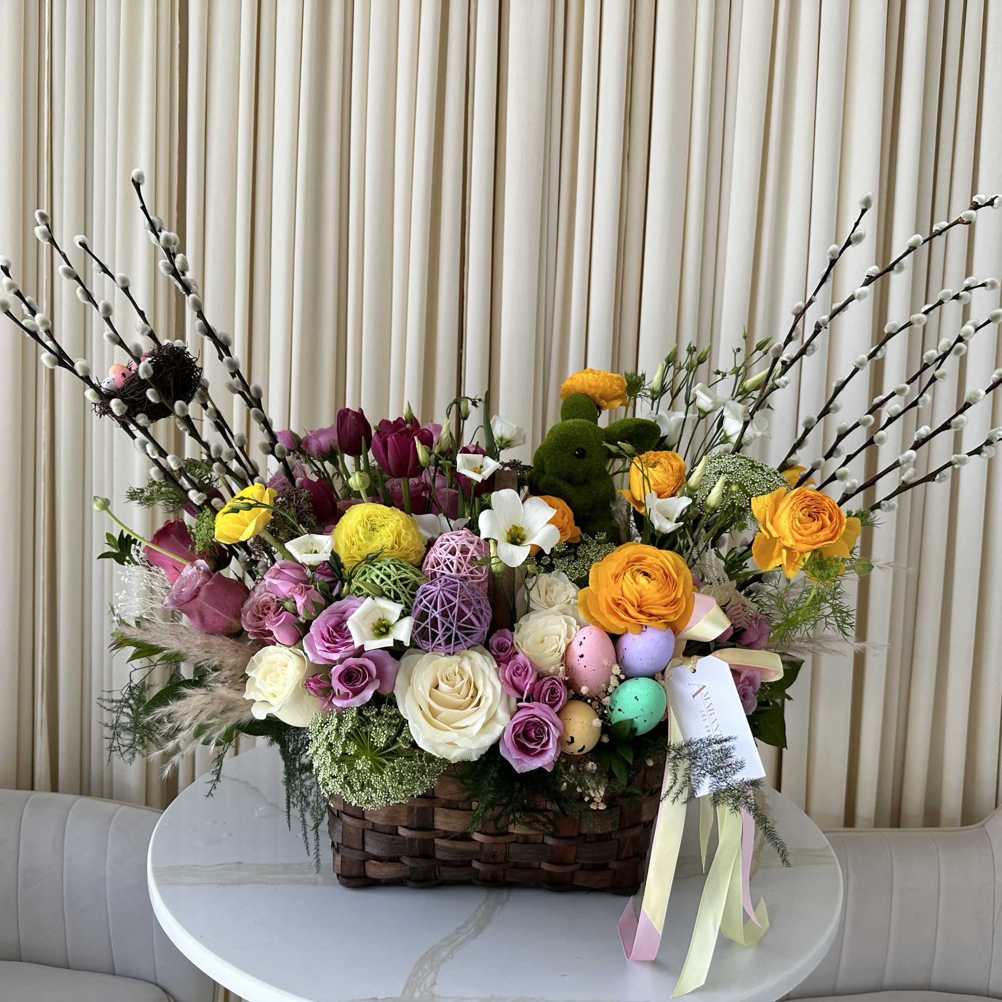 Celebrate the joy of Easter with this delightful basket overflowing with bright