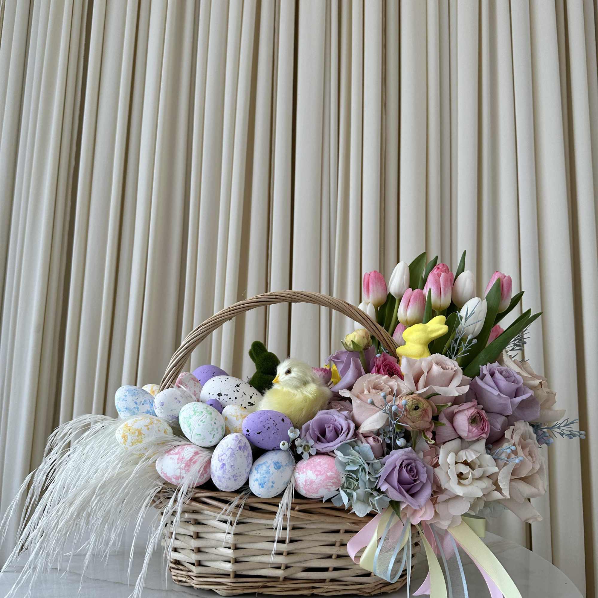Celebrate the joy of Easter with this delightful basket filled with springtime