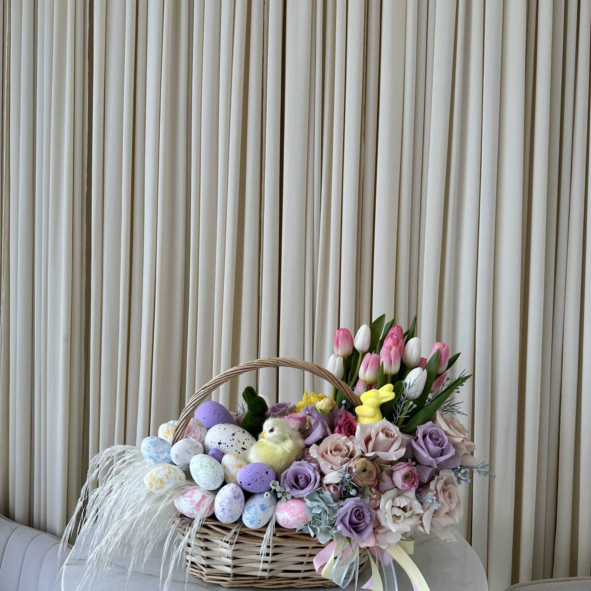 Celebrate the joy of Easter with this delightful basket filled with springtime