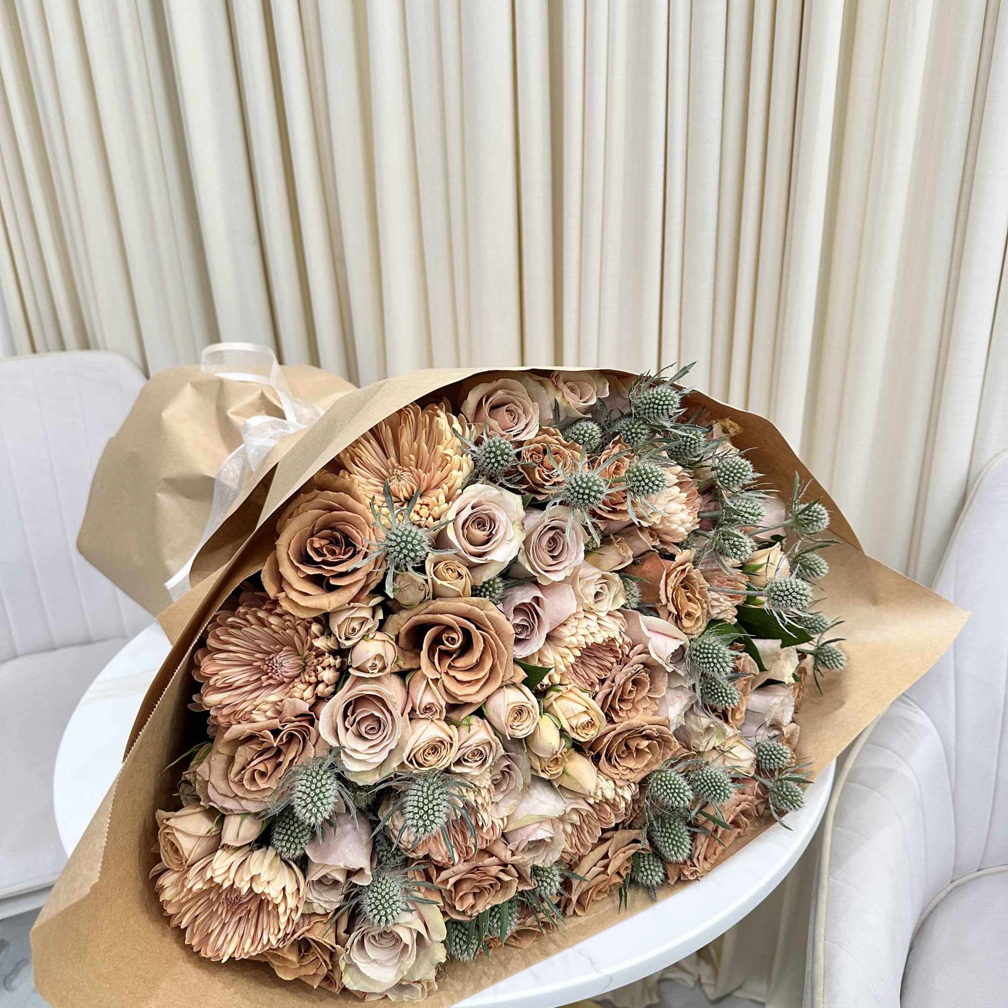 This beautiful bouquet features a mix of seasonal blooms in soft, muted