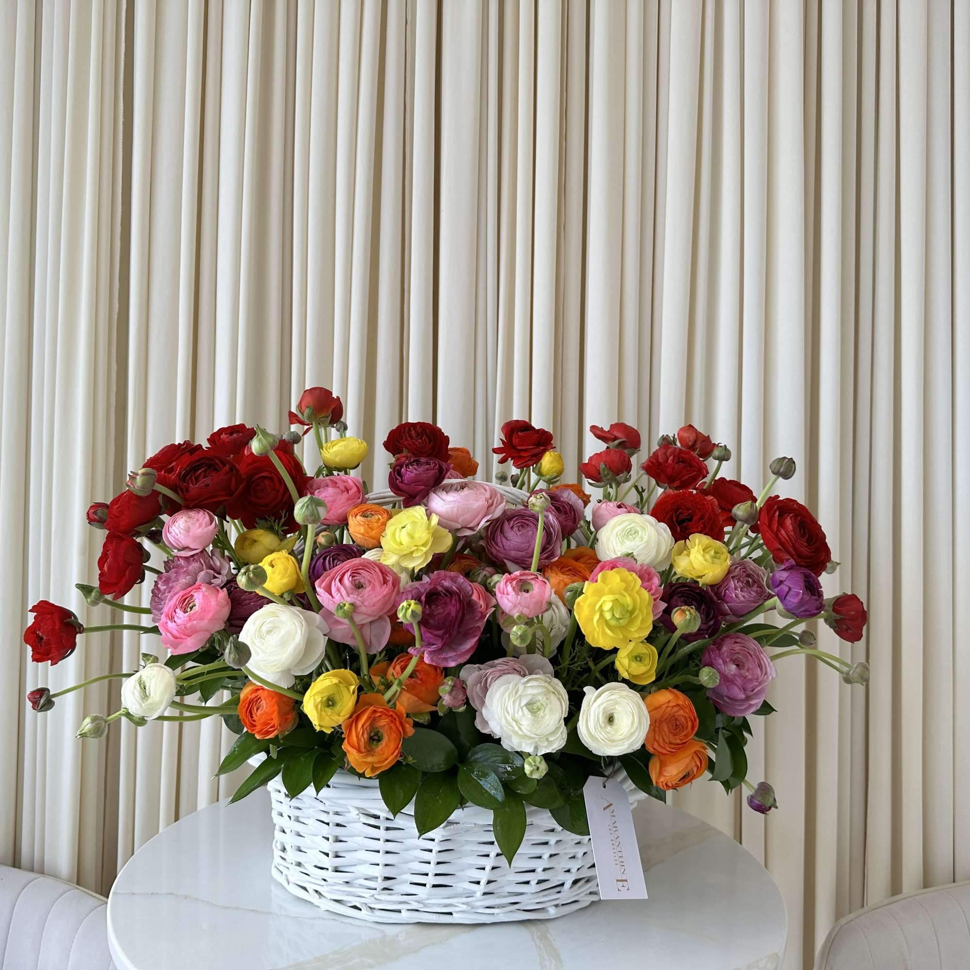 Ring in the new season with this delightful basket overflowing with colorful