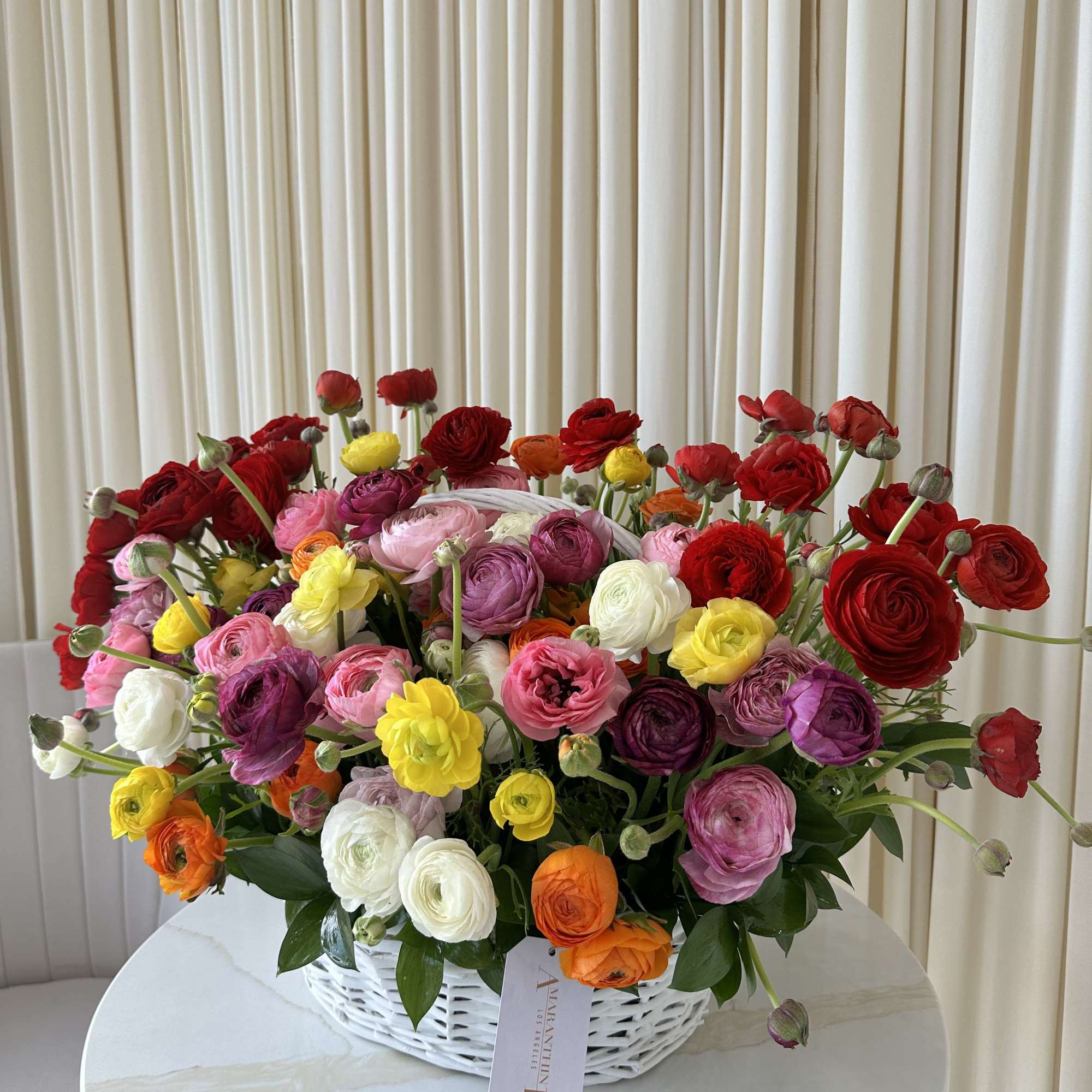 Ring in the new season with this delightful basket overflowing with colorful