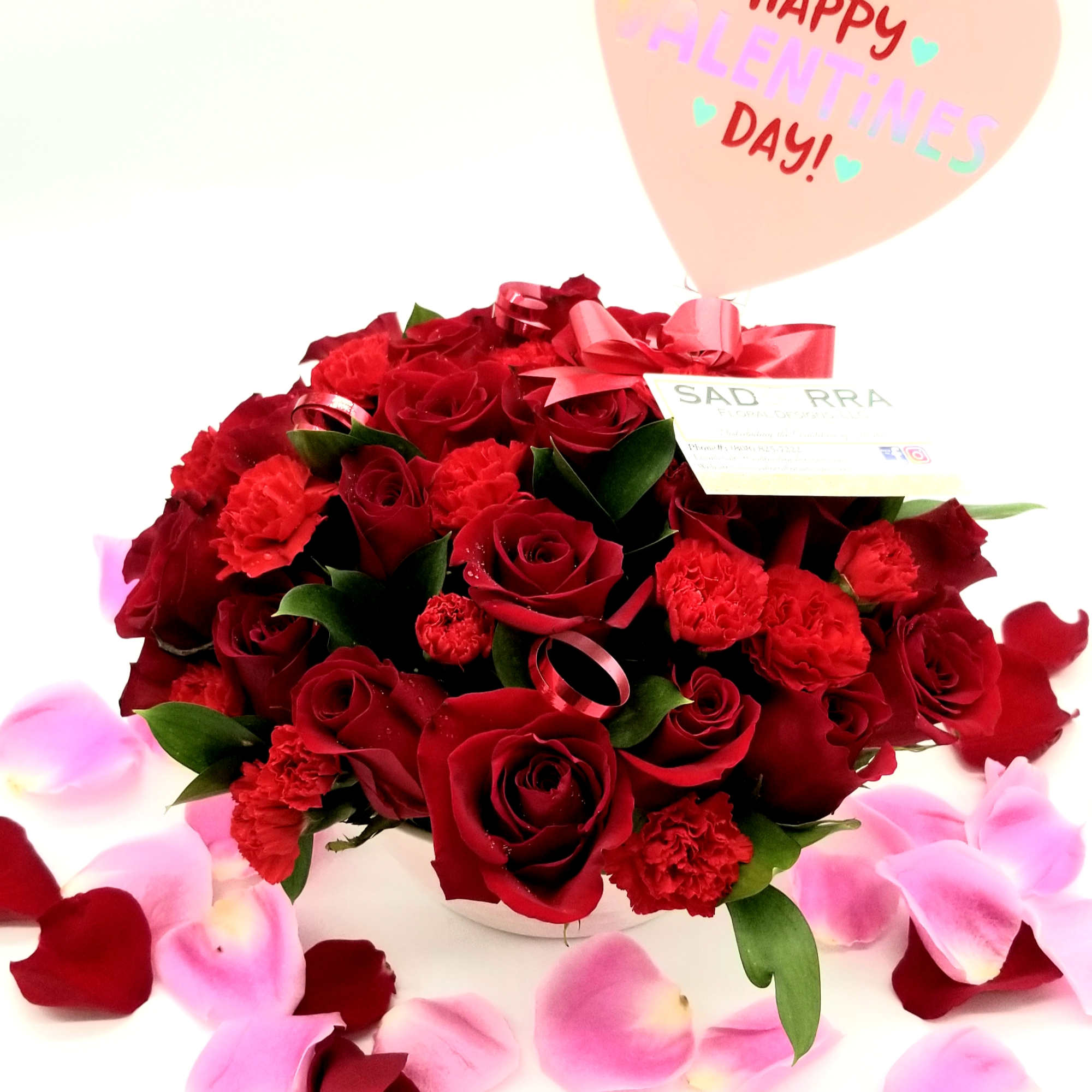 A Beautiful array of 24 Red Roses &amp; Mini Carnations arranged in