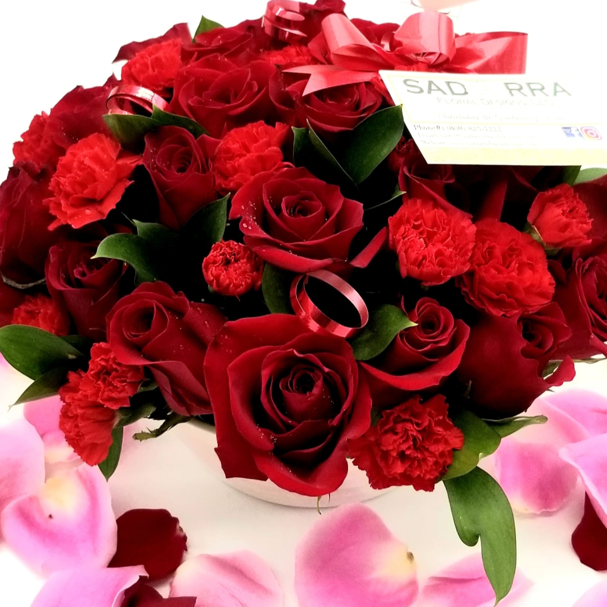 A Beautiful array of 24 Red Roses &amp; Mini Carnations arranged in
