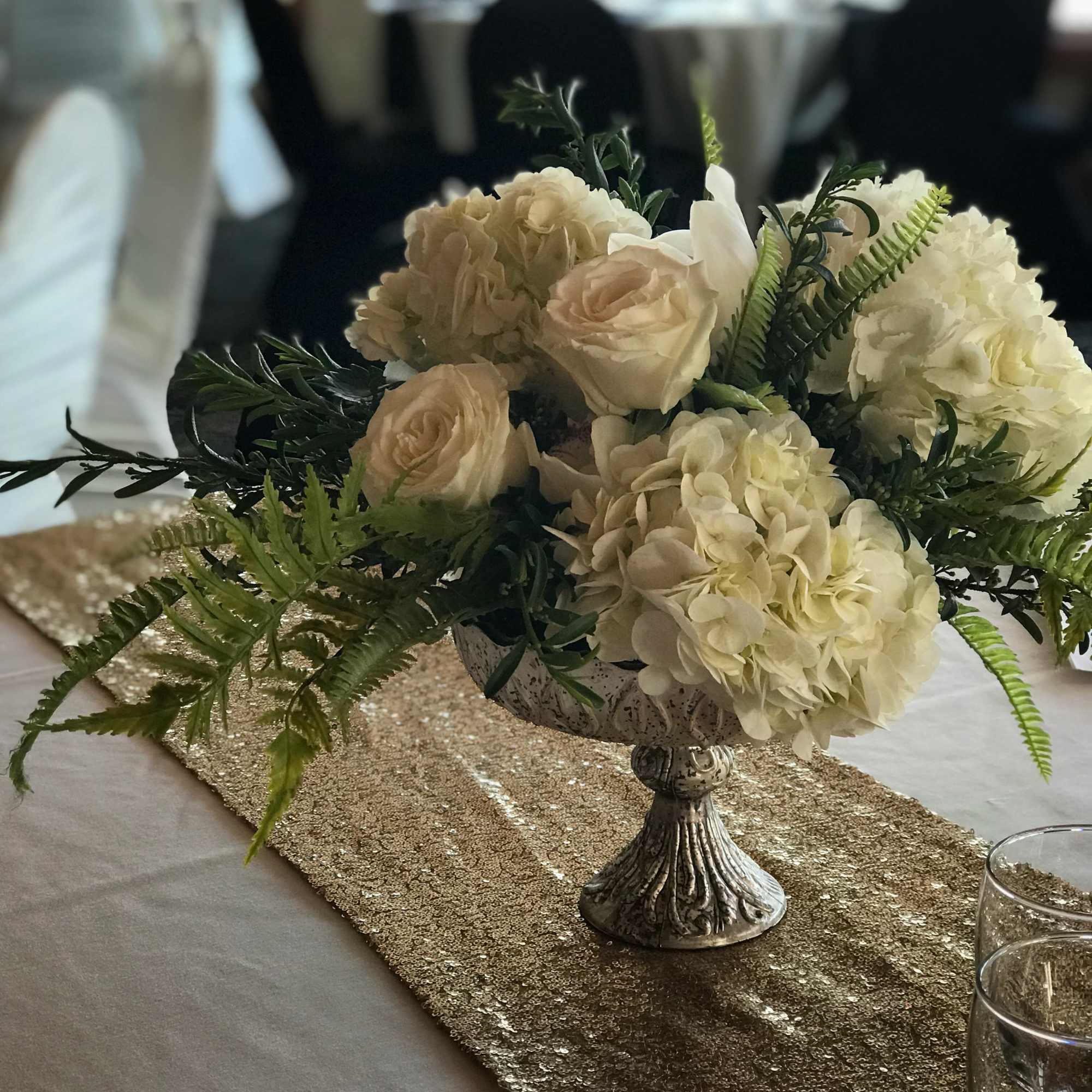 A simple elevated glass dish filled with flowers to coordinate with the A simple elevated glass dish filled with flowers to coordinate with the