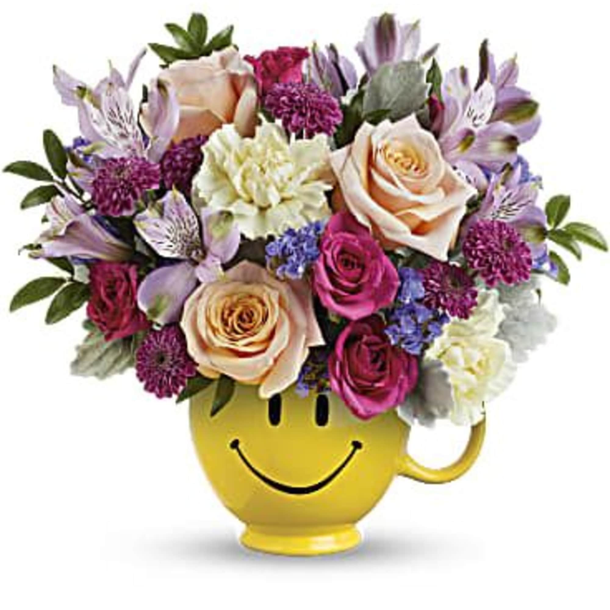 Send a cuppa cheer with this happy surprise of colorful roses and