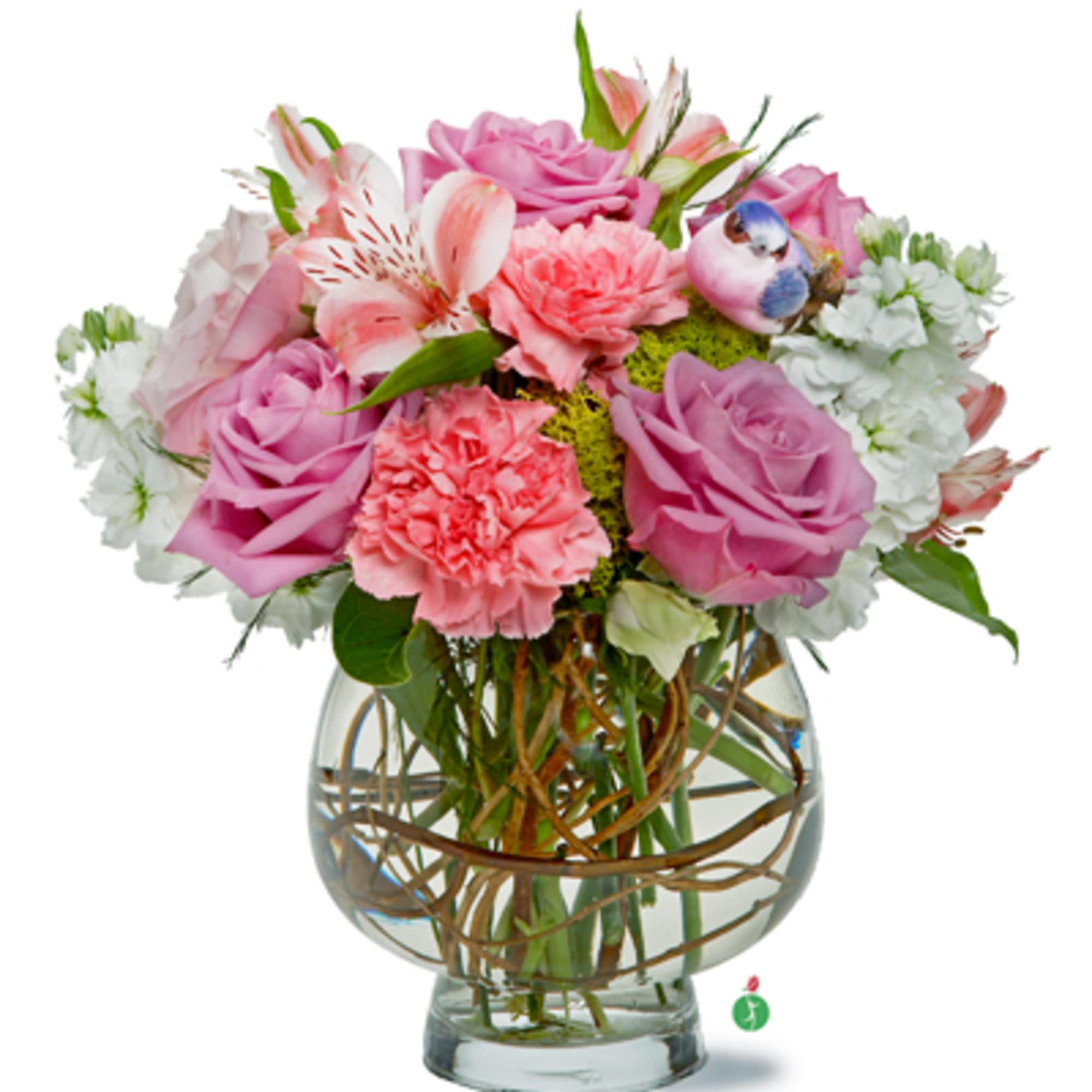 This soft display of pink carnations, alstromeria, and purple roses with a This soft display of pink carnations, alstromeria, and purple roses with a