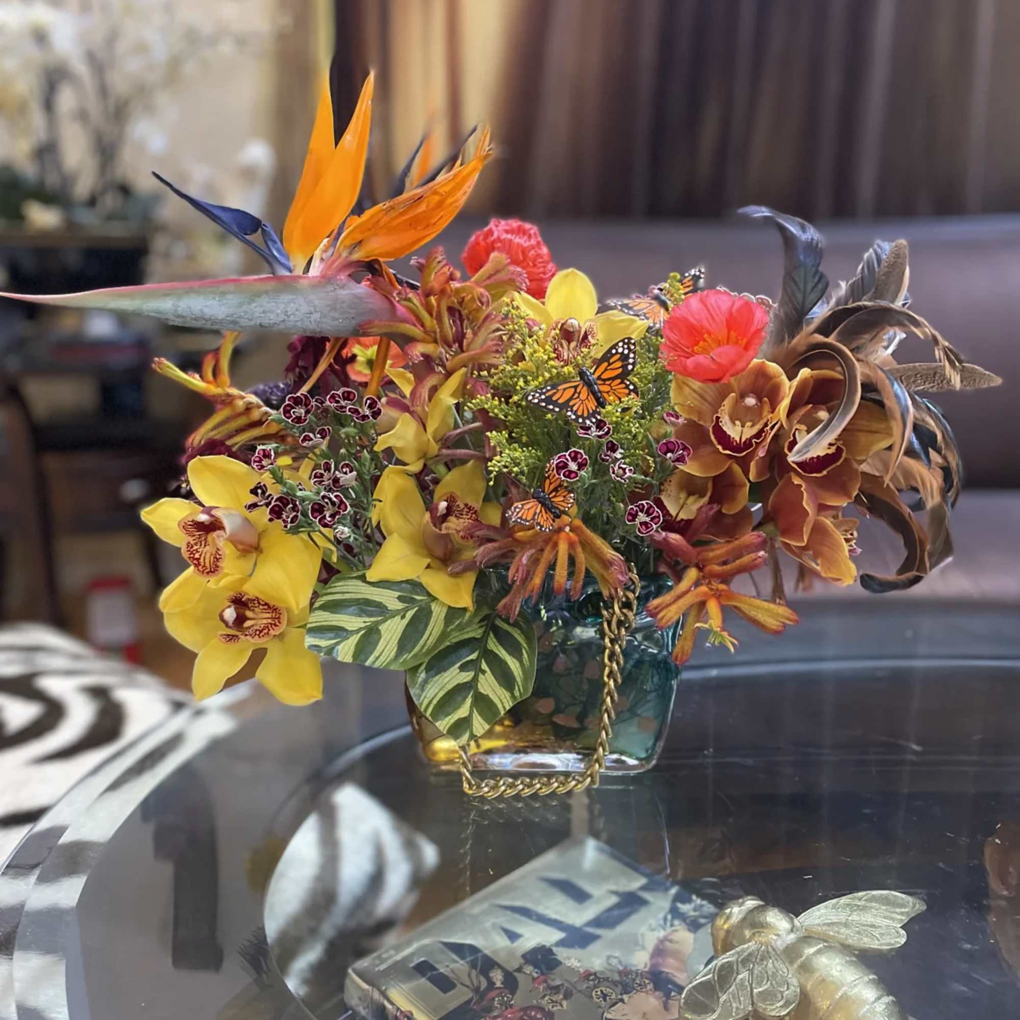 Discover the allure of tropical florals with our stunning arrangement featuring vibrant