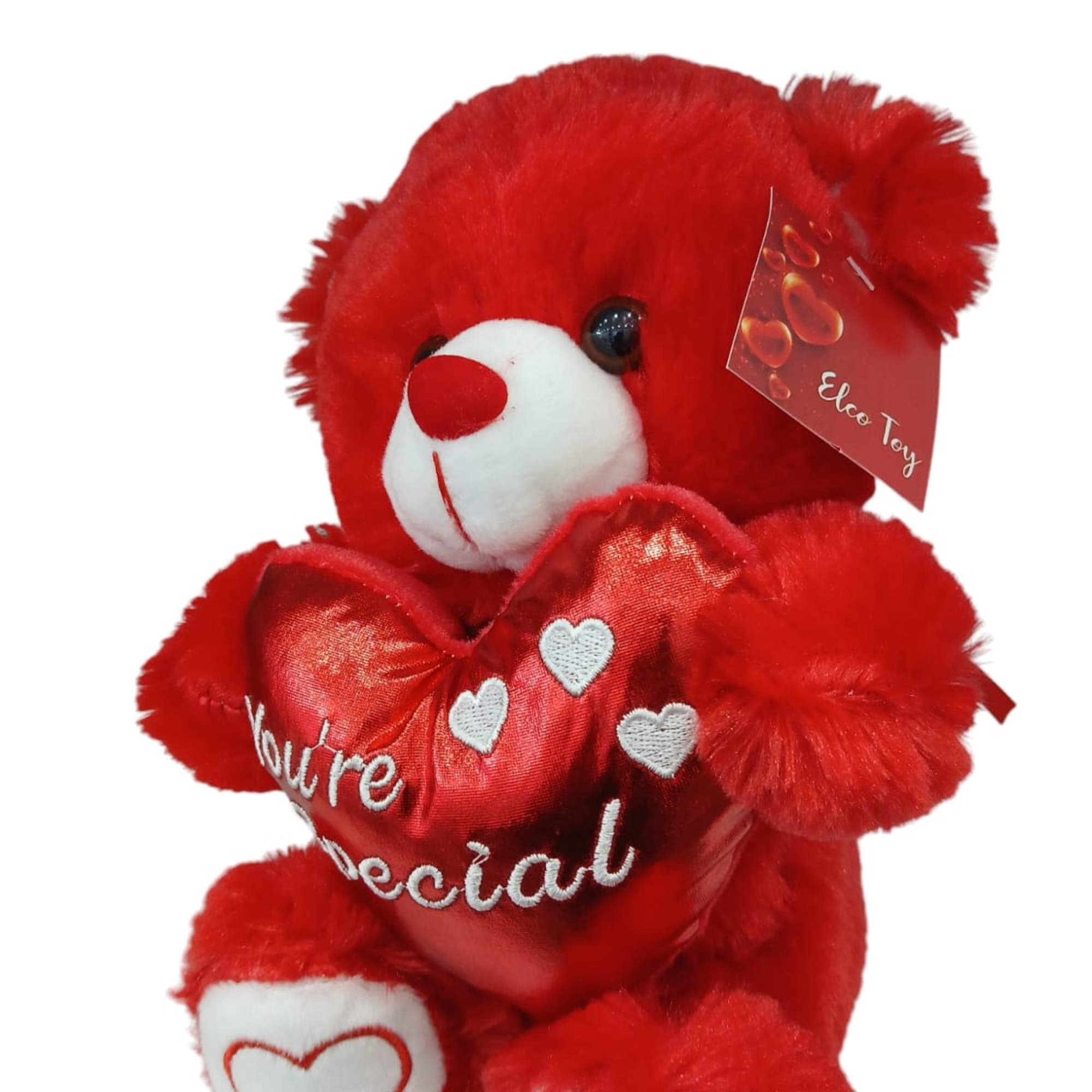 This adorable red teddy bear holds a shiny heart with the message This adorable red teddy bear holds a shiny heart with the message