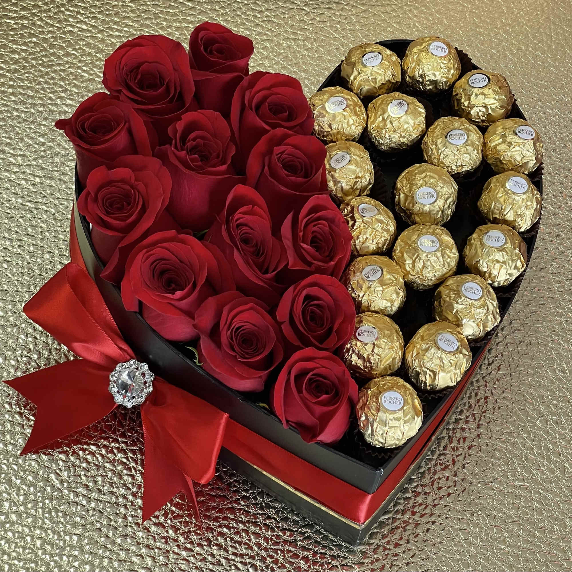 Standard carries a dozen roses plus chocolate, deluxe has 18 roses and