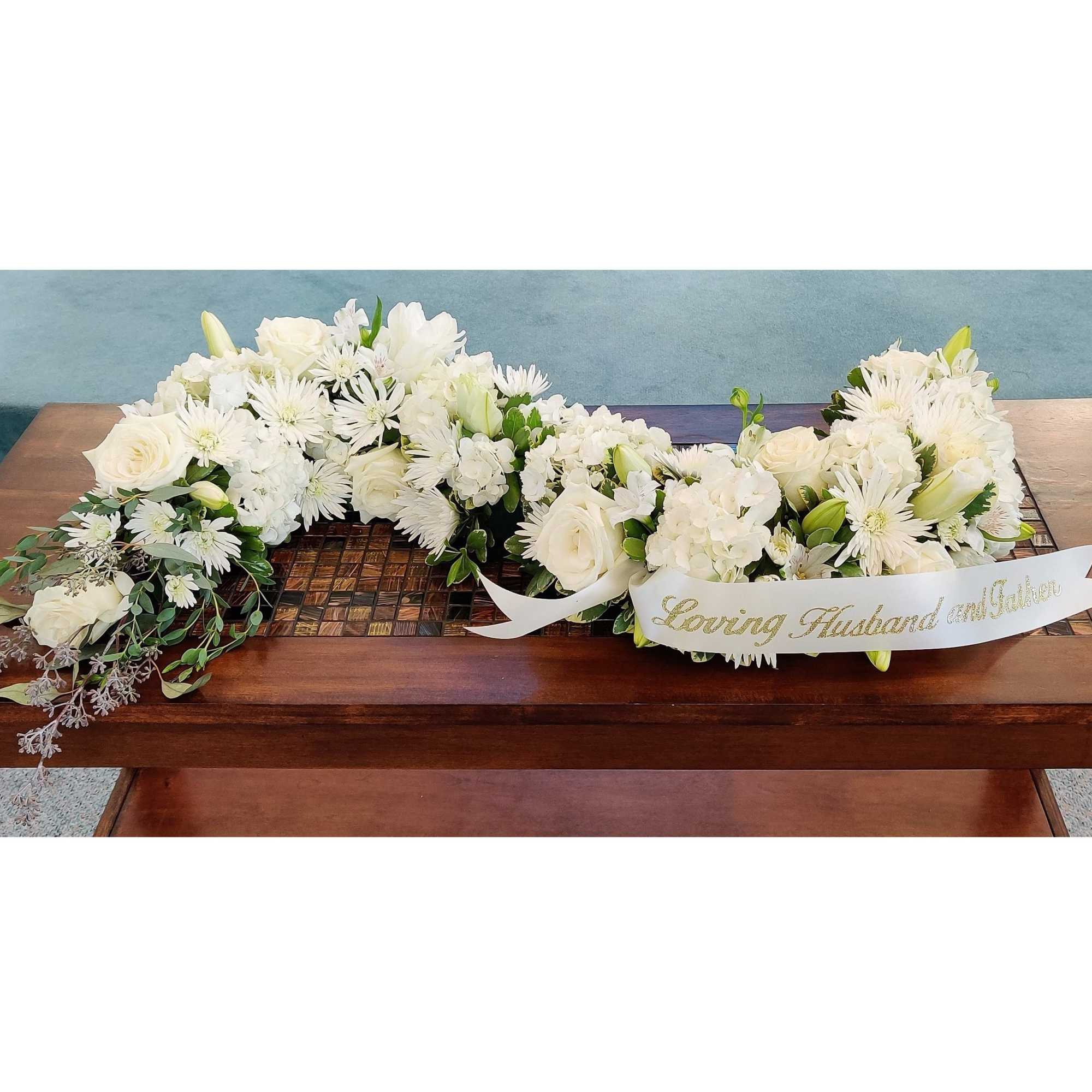 Our signature S-Shaped Urn Surround arrangement made with elegant mixed blooms in Our signature S-Shaped Urn Surround arrangement made with elegant mixed blooms in