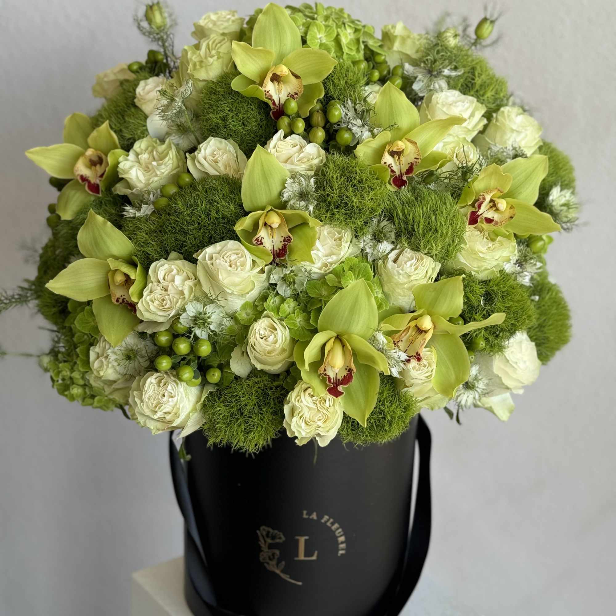 A lush, all-green arrangement that captures the tranquility of nature. Featuring the