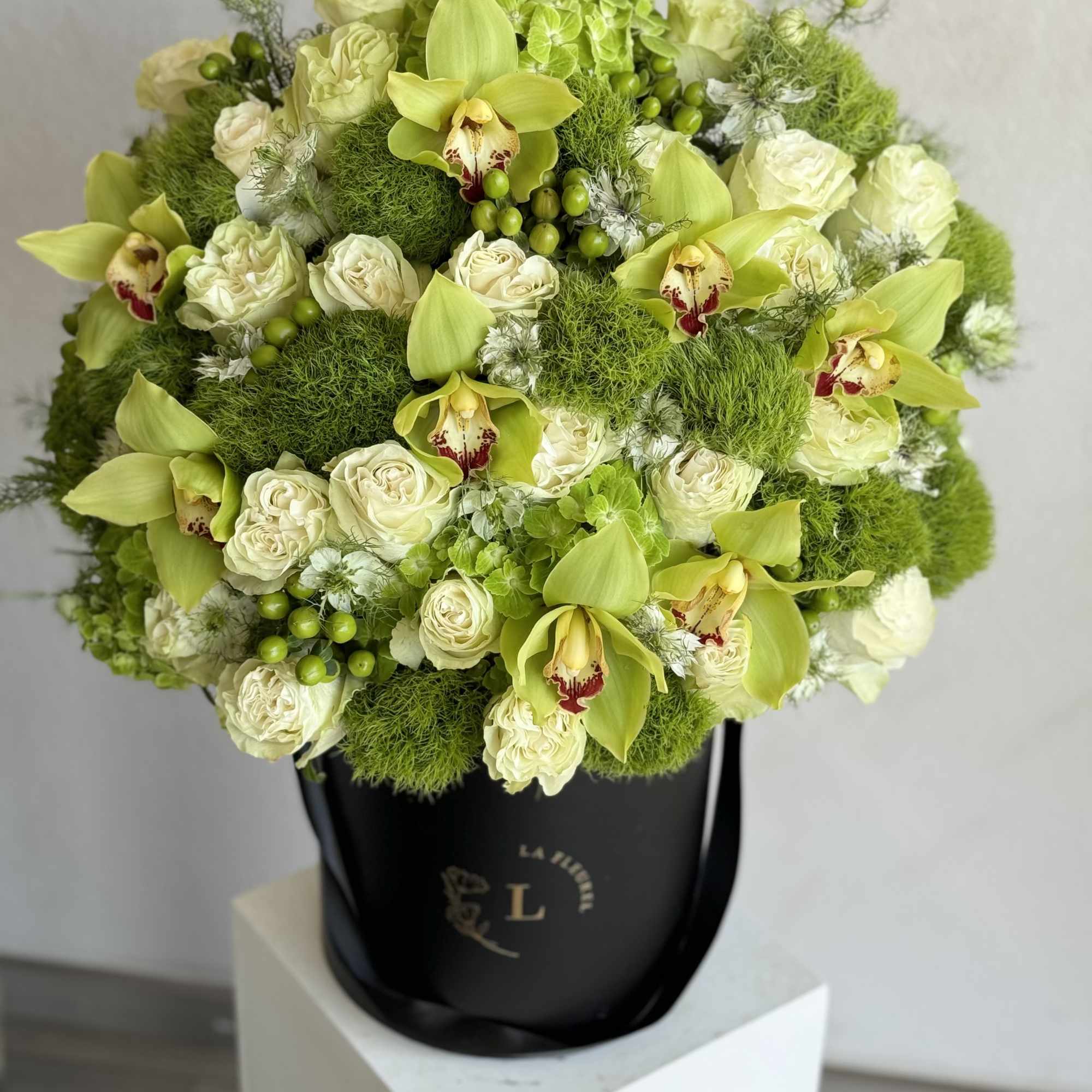 A lush, all-green arrangement that captures the tranquility of nature. Featuring the