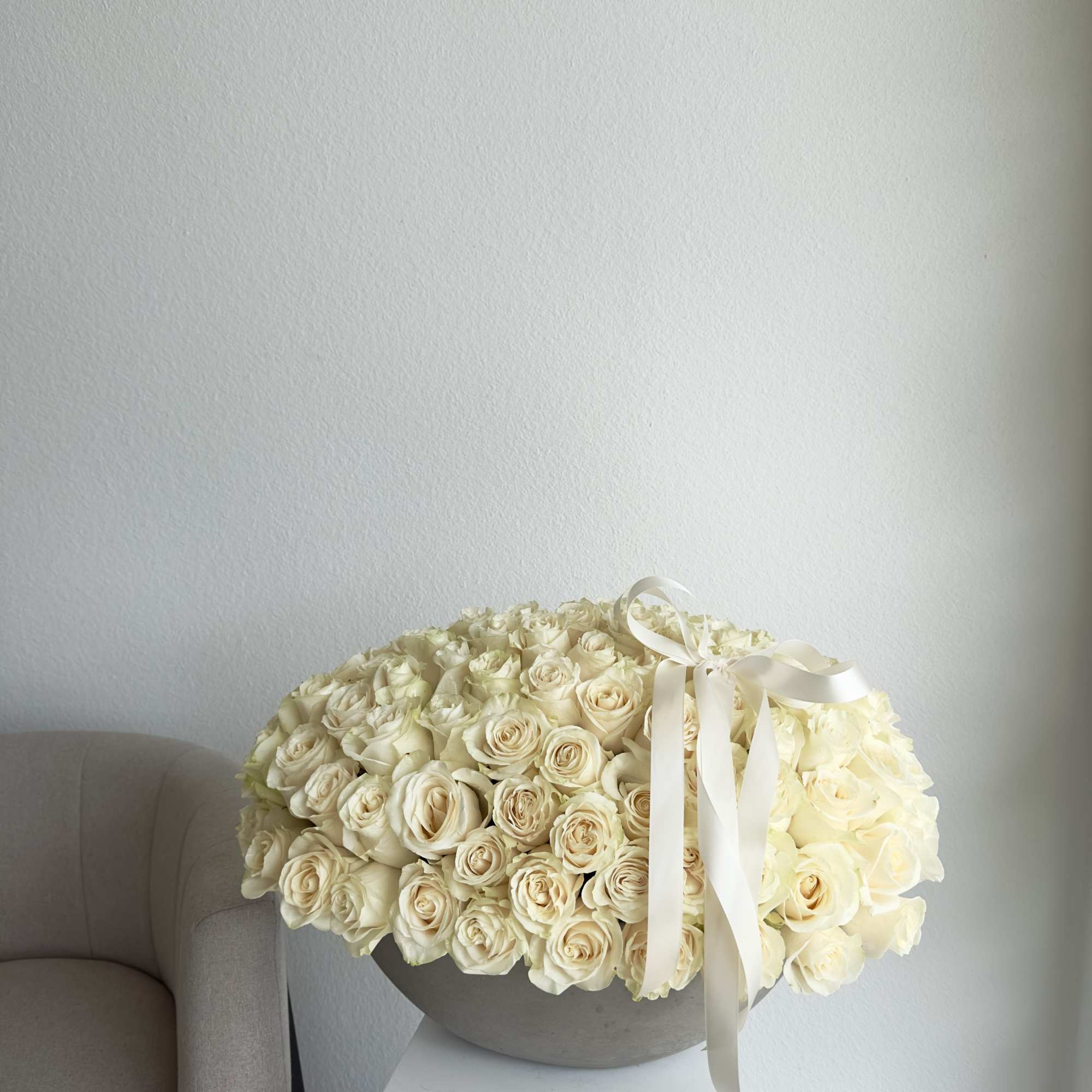 100-125 WHITE ROSES 

This breathtaking arrangement includes white roses. 
Perfect for any