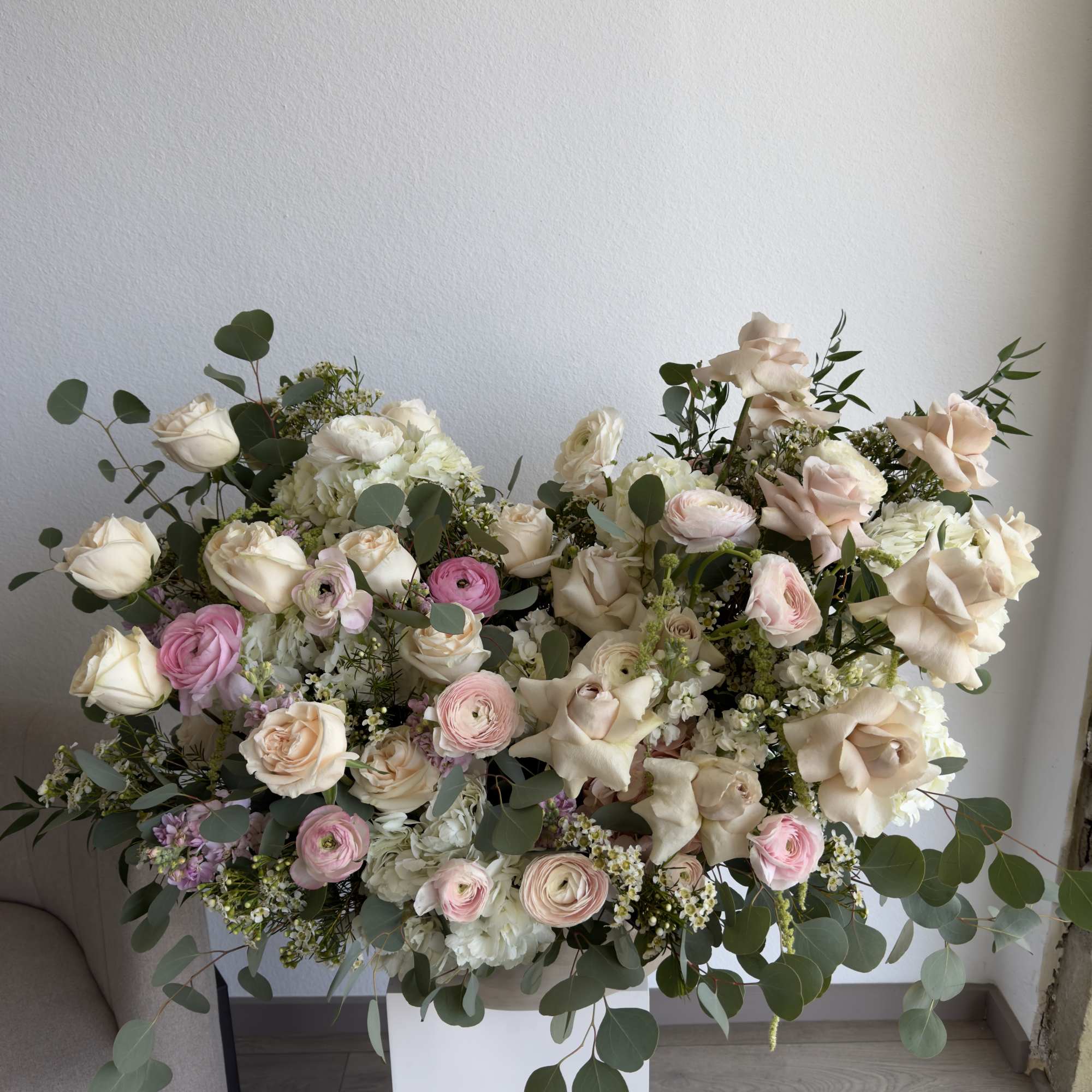 This beautiful arrangement filled with the roses, hydrangeas, peonies and orchids to
