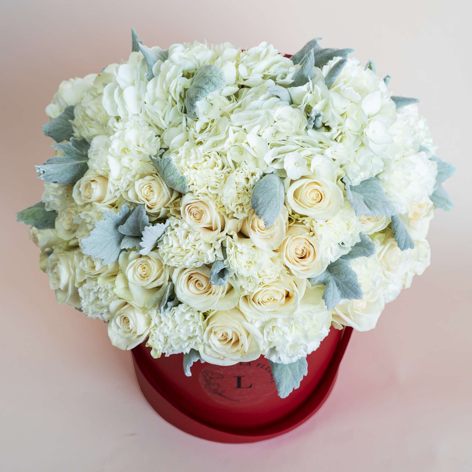 This beautiful arrangement is filled with white roses to deliver your special