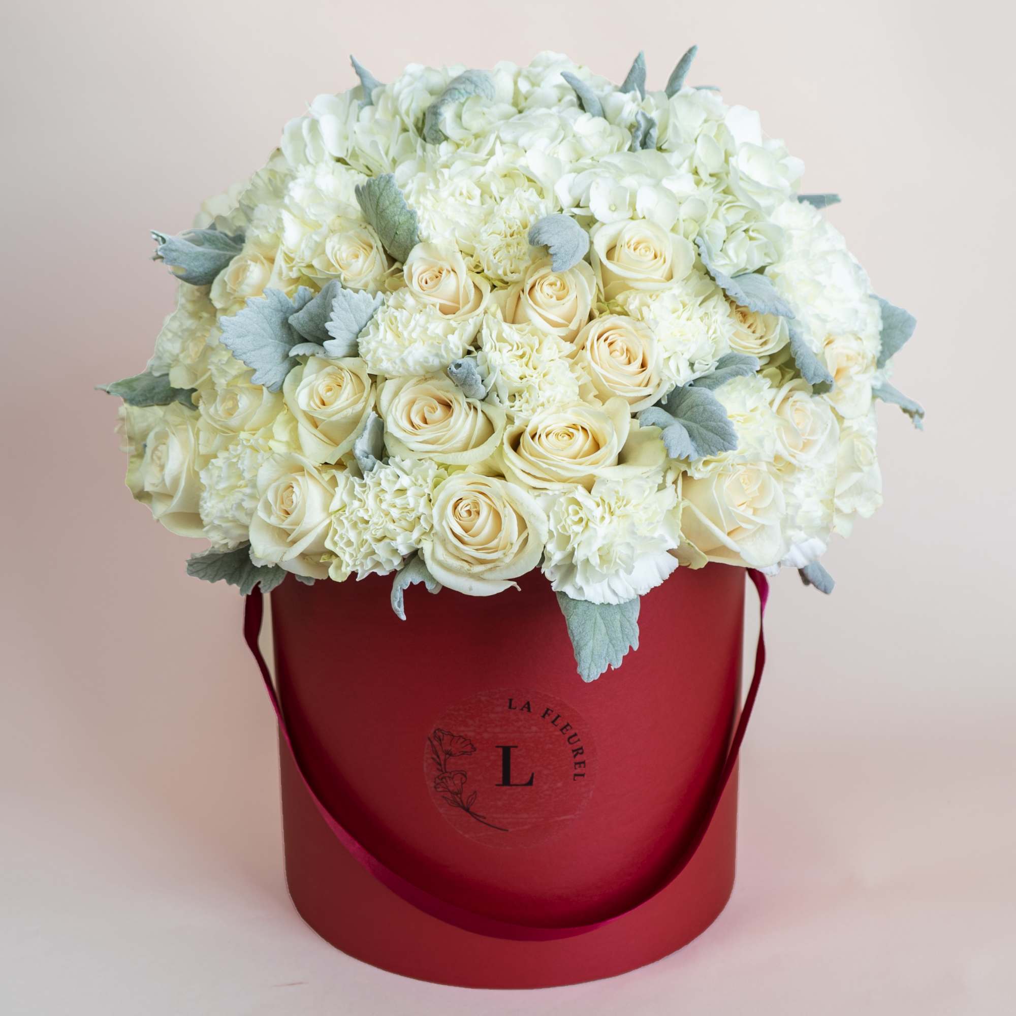 This beautiful arrangement is filled with white roses to deliver your special