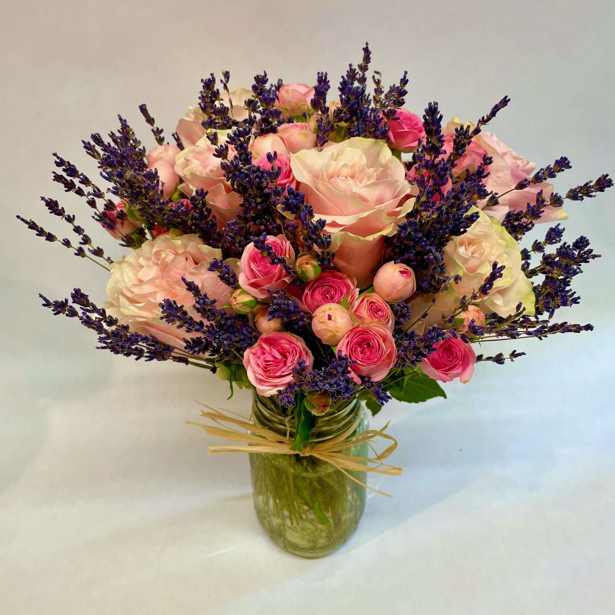 A stunning rose variety-- this sweet and fragrant jar features one dozen