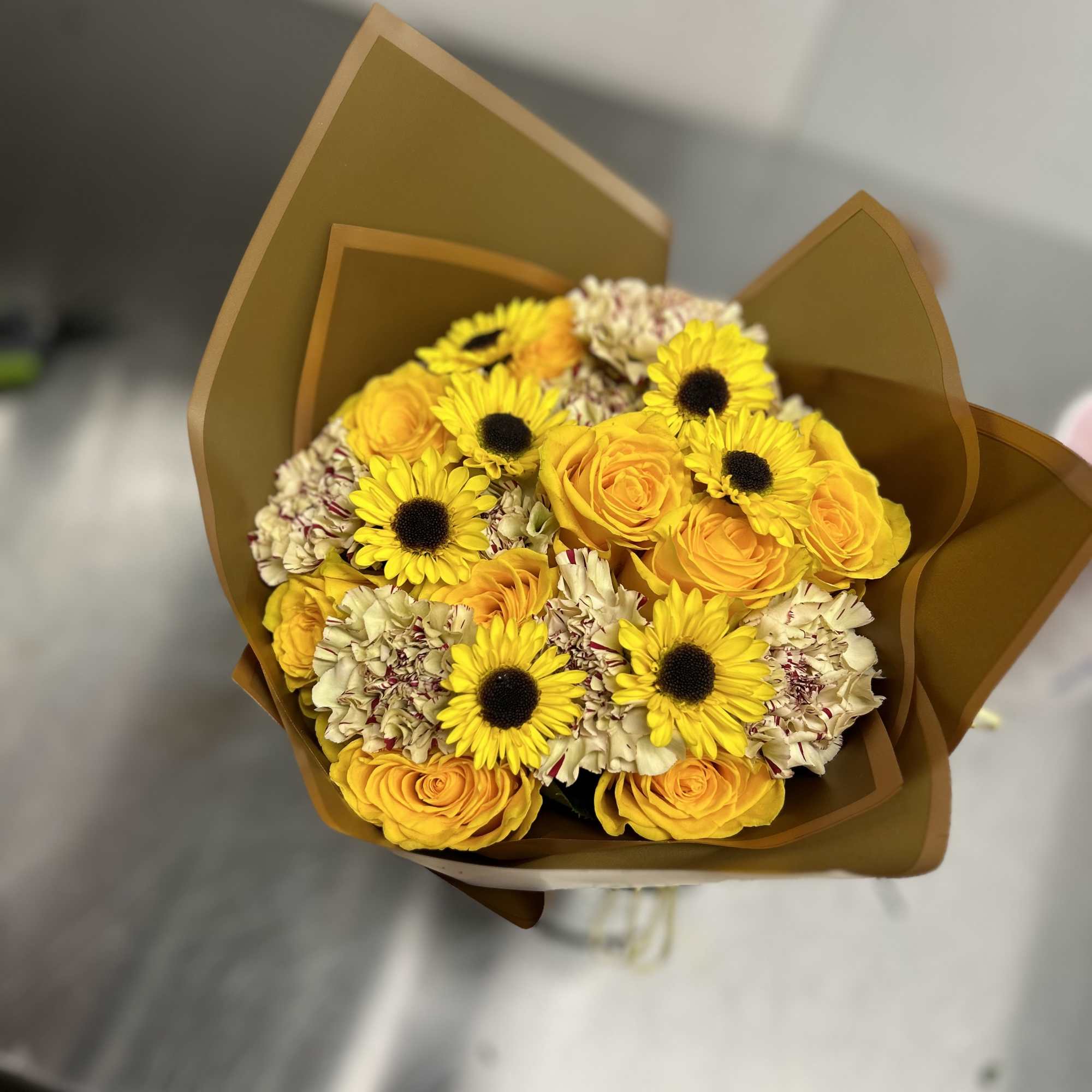 Beautiful custom arrangement of florals wrapped up for you to gift to