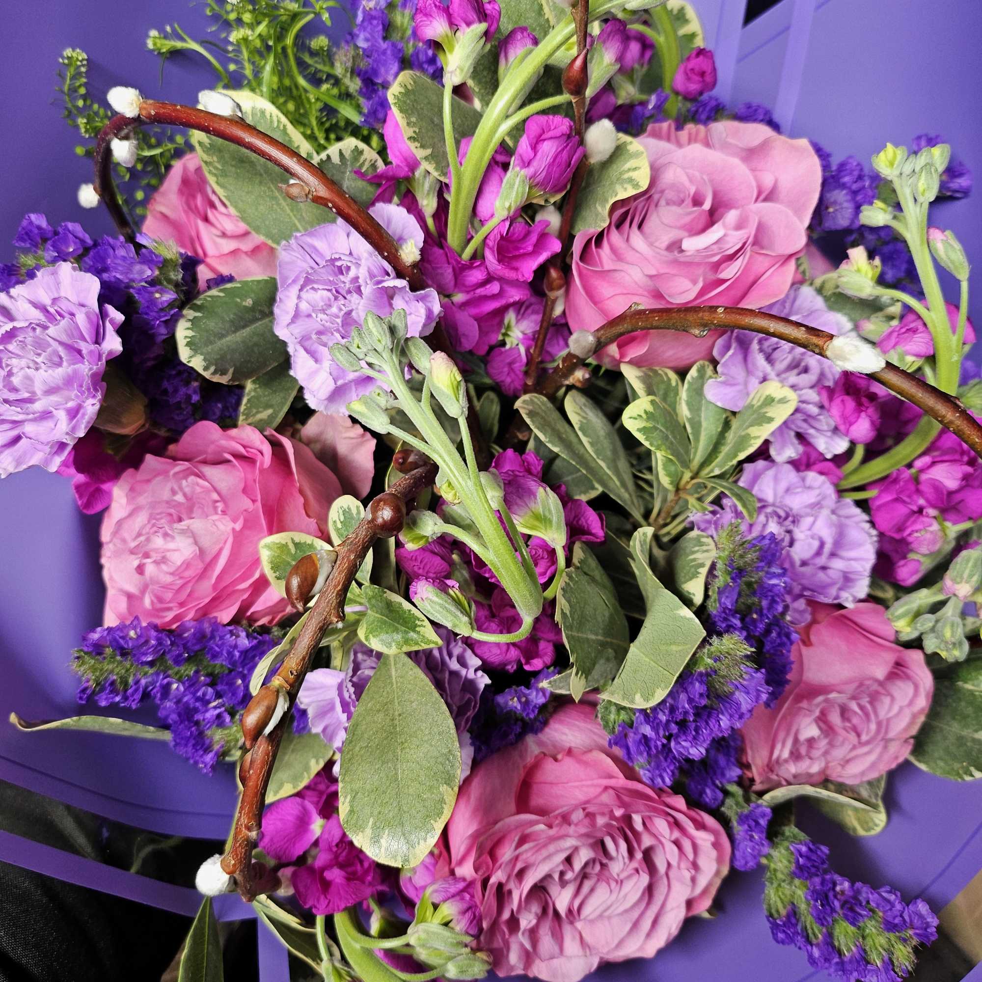 Indulge in the mesmerizing hues of this "Radiant Lavender Bliss" bouquet. Featuring Indulge in the mesmerizing hues of this "Radiant Lavender Bliss" bouquet. Featuring