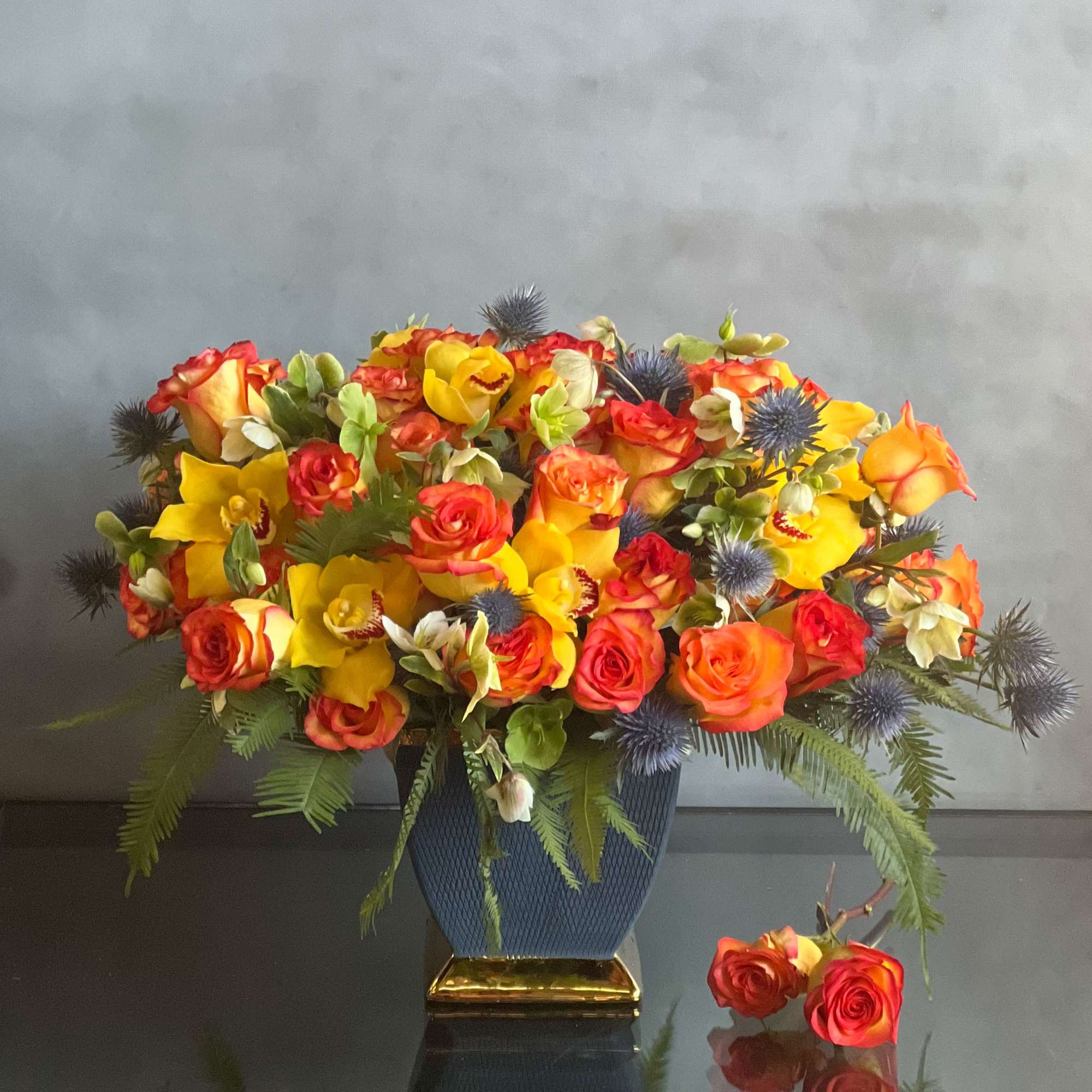 Amidst a cluster of beautiful multi-pigmented Roses of extraordinary hues are artfully