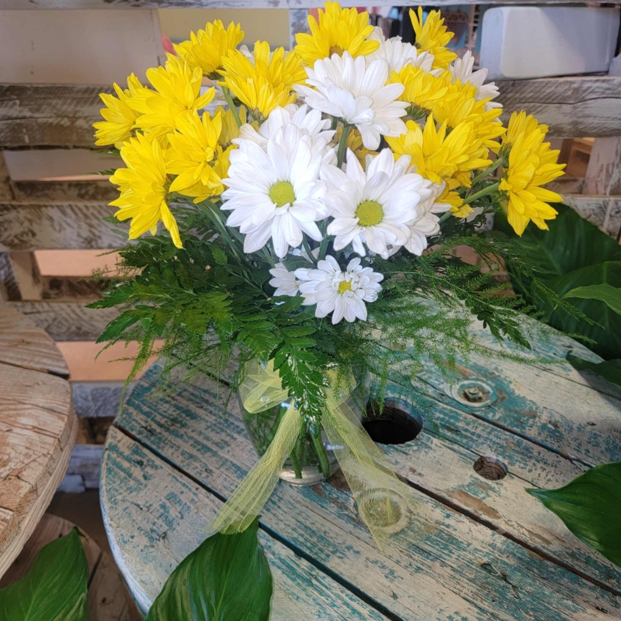 What could be sweeter than a cheerful glass vase filled with white