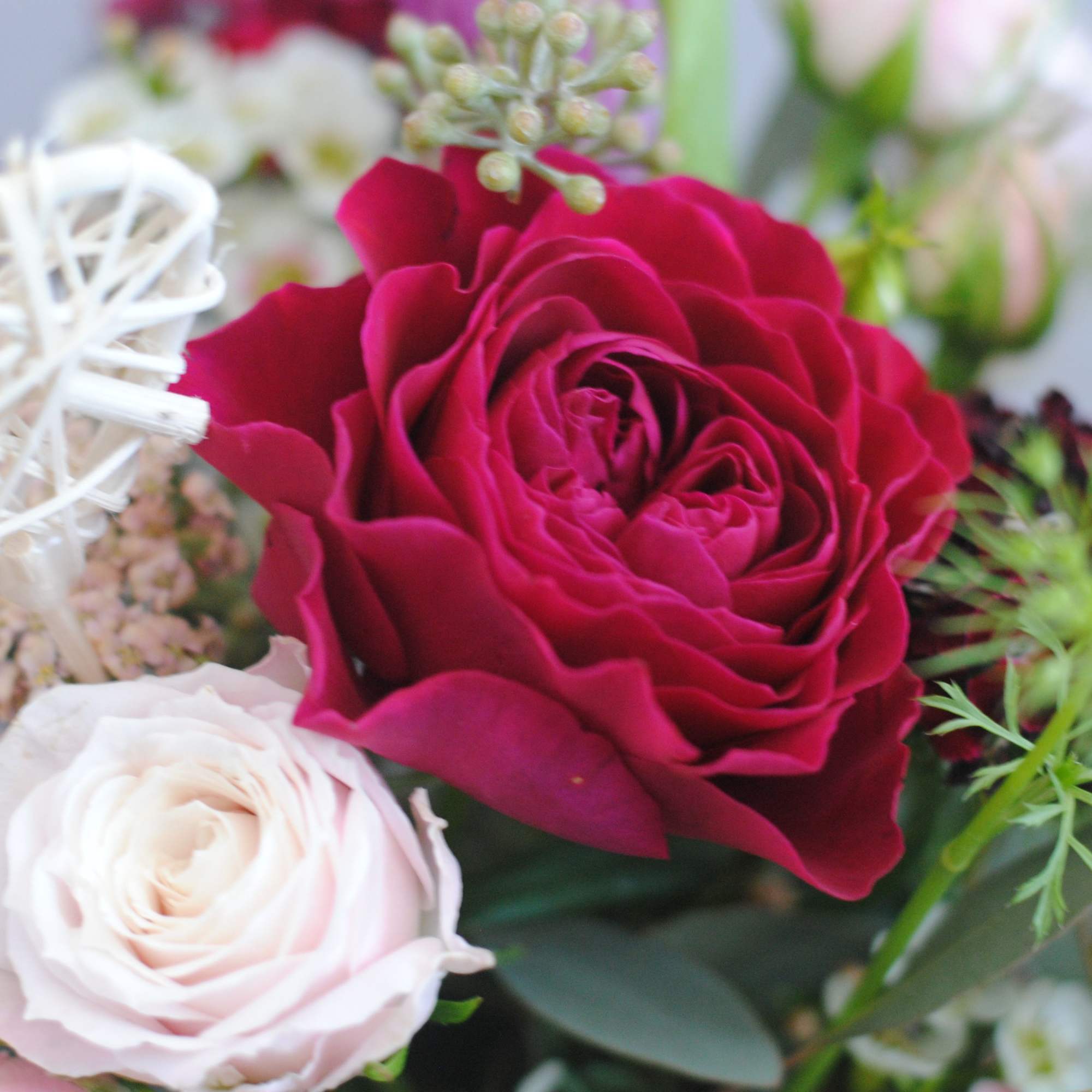 A Valentine's Day themed mug bursting with fresh American Grown flowers and A Valentine's Day themed mug bursting with fresh American Grown flowers and