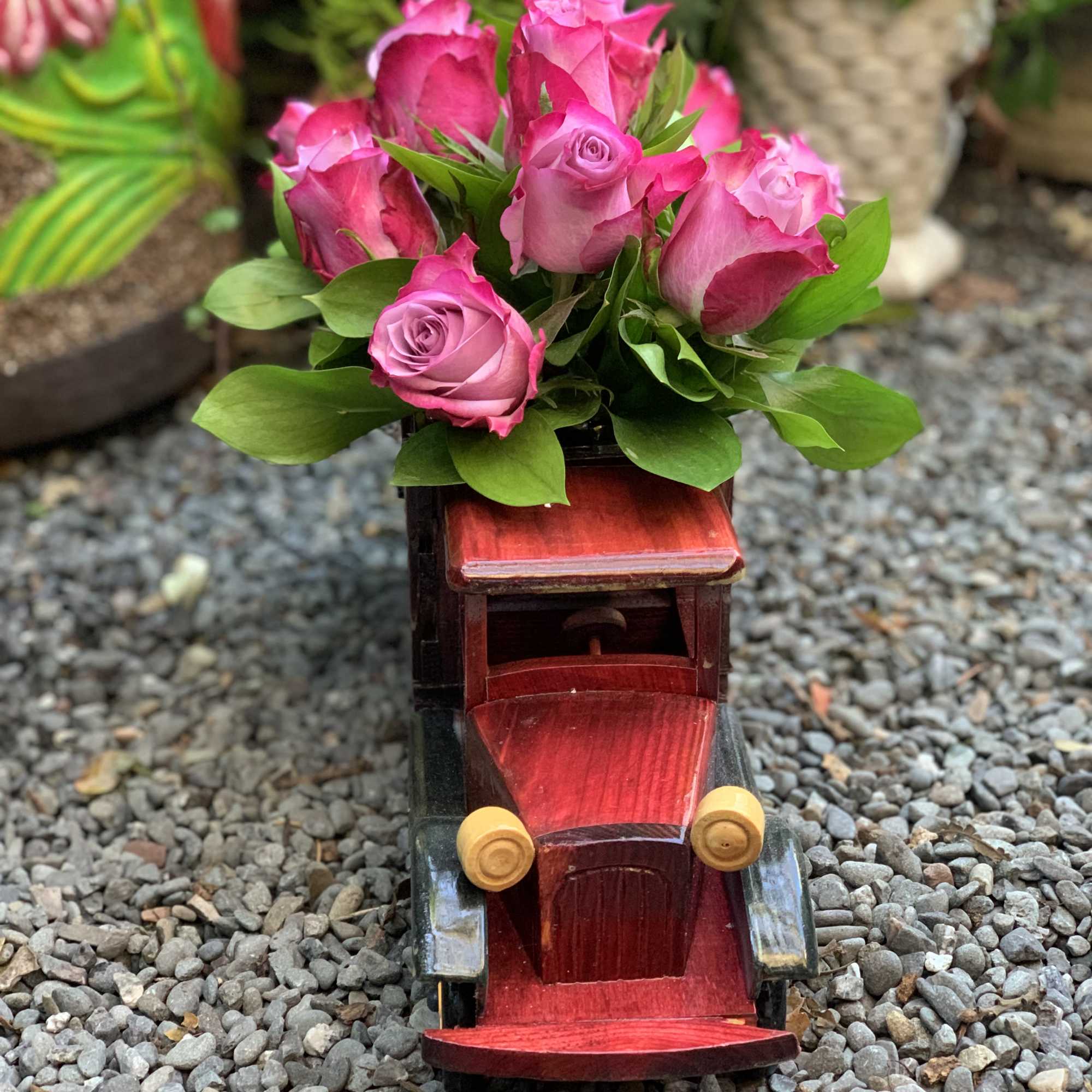 Dozen Seasonal Roses in a wooden truck model Dozen Seasonal Roses in a wooden truck model