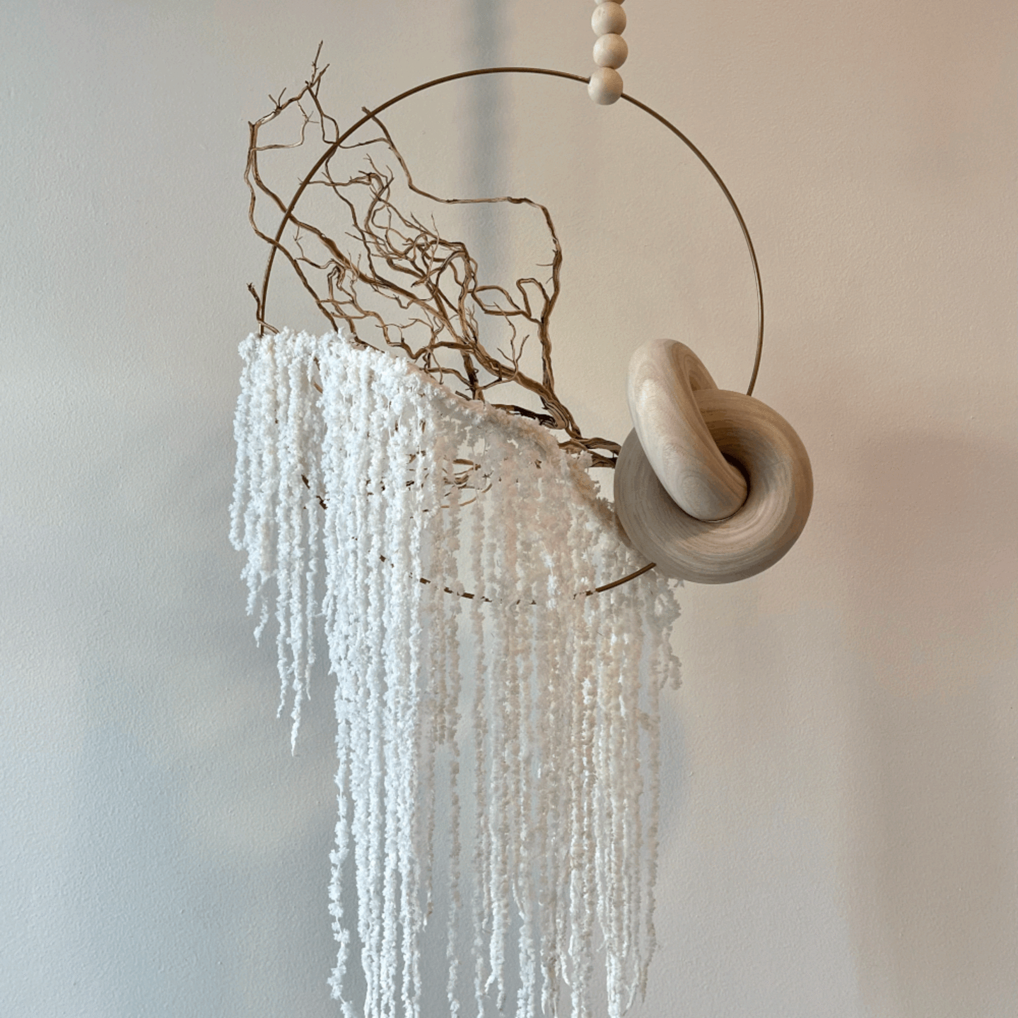 - Hanging floral arrangement with calming palette of neutral tones
- Variety of