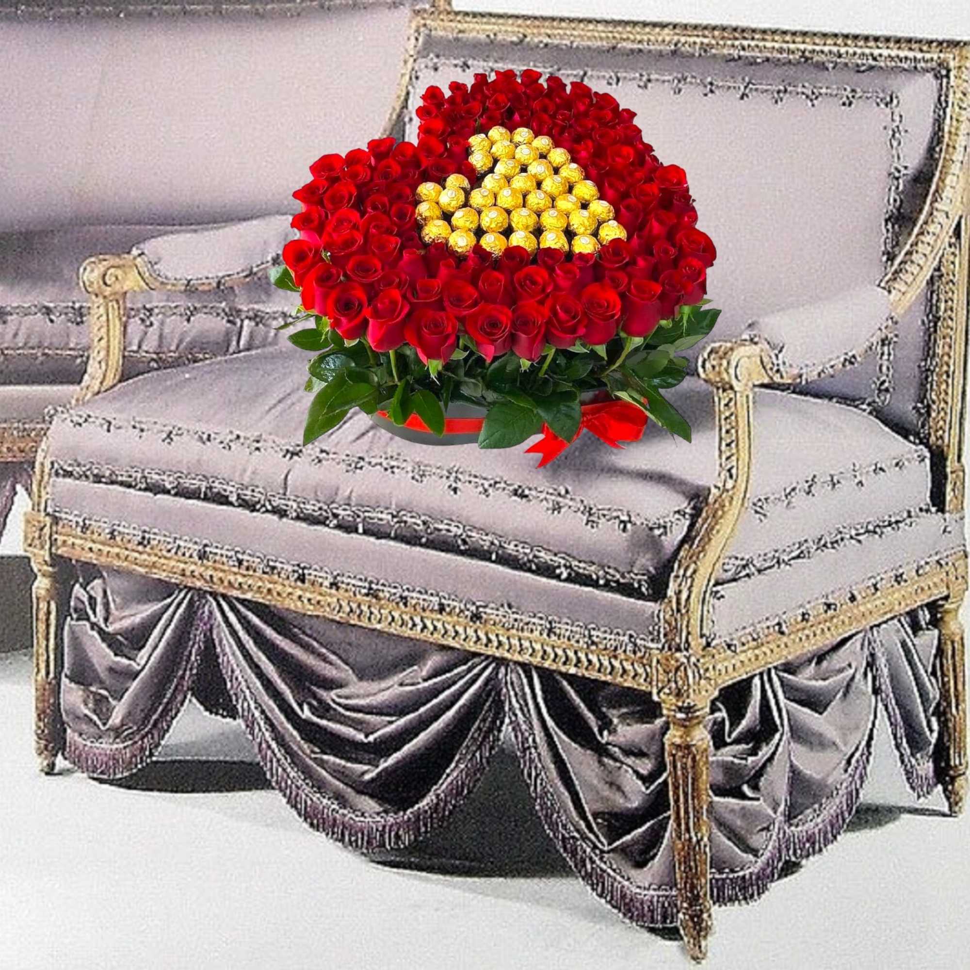 A modern flower arrangement in a heart box filled with roses &amp;