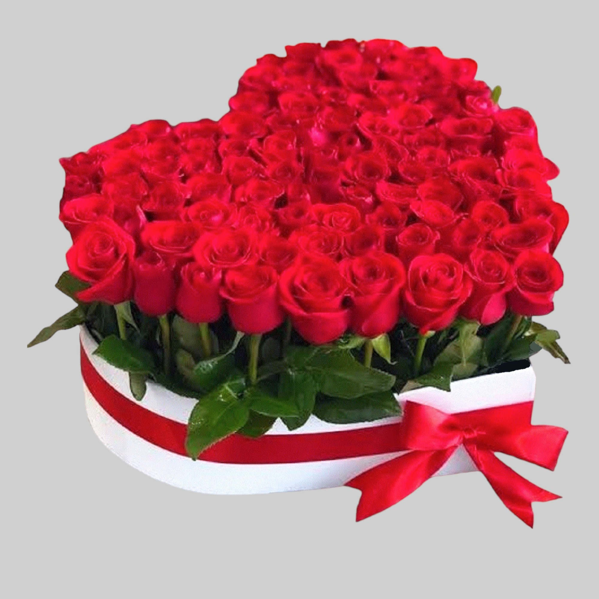 A modern flower arrangement in a heart box filled with roses.

DETAILS
This heart
