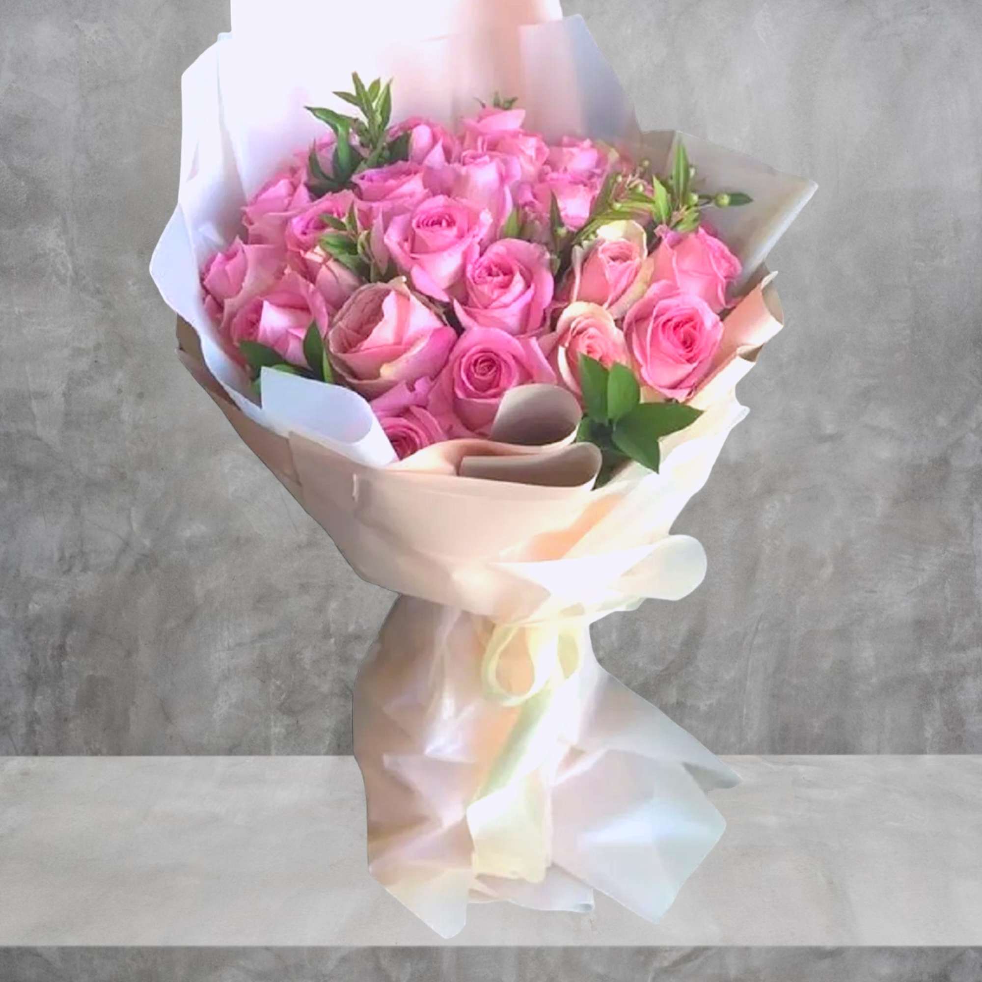 Send this beautiful, wrapped bouquet of pink roses to someone special. Perfect
