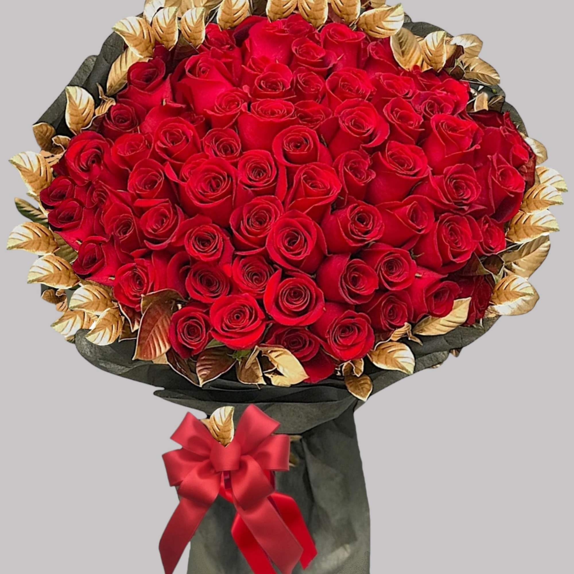 Surprise them with a beautiful bouquet of red roses and gold painted